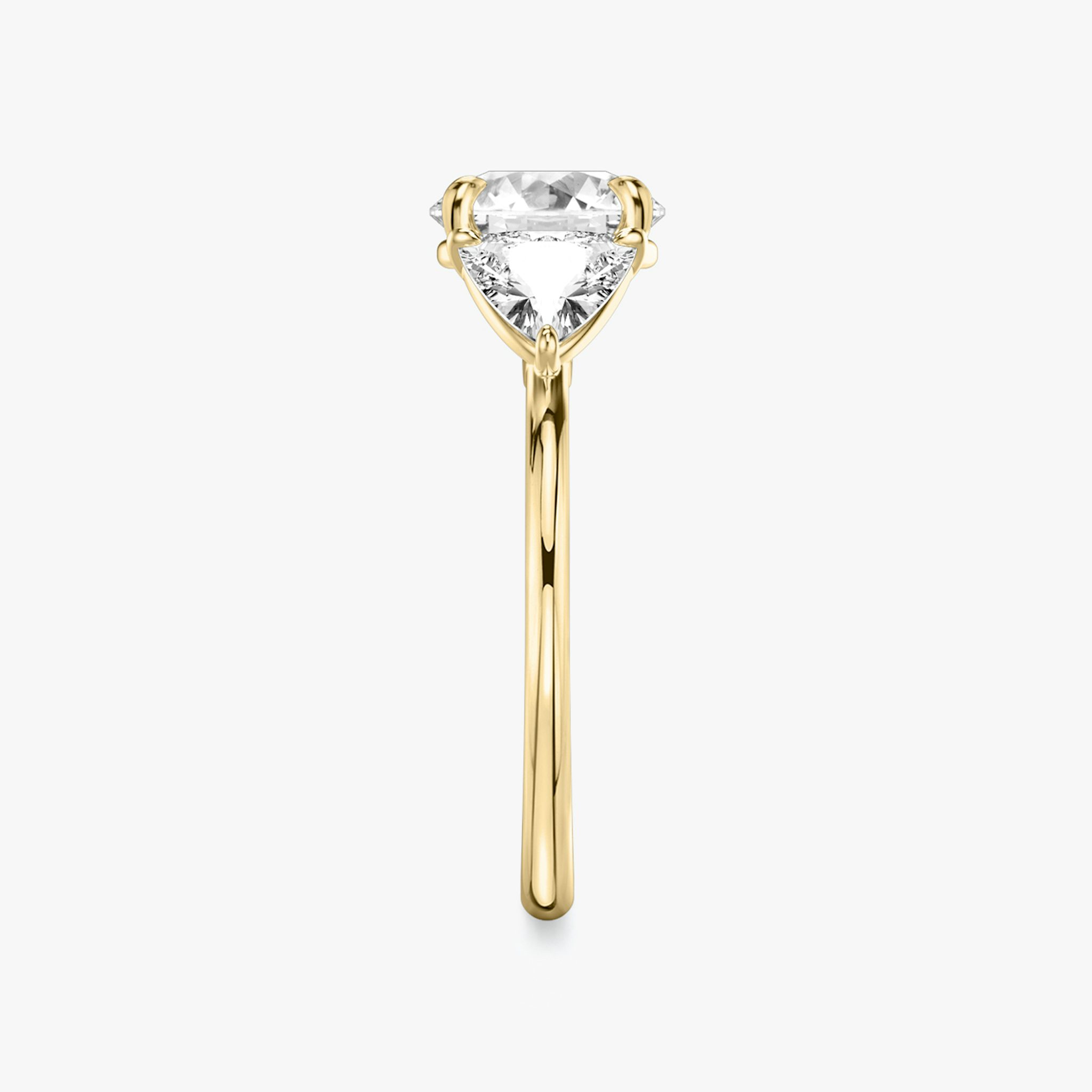 The Three Stone | Round Brilliant | 18k | Yellow Gold | bandAccent: Plain | caratWeight: other | sideStoneCarat: 0.50ct | sideStoneShape: Trillion | diamondOrientation: vertical