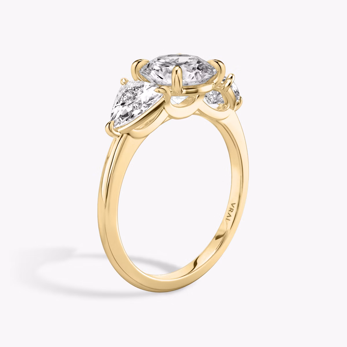 The Three Stone | Round Brilliant | 18k | Yellow Gold | bandAccent: Plain | caratWeight: other | sideStoneCarat: 0.50ct | sideStoneShape: Trillion | diamondOrientation: vertical