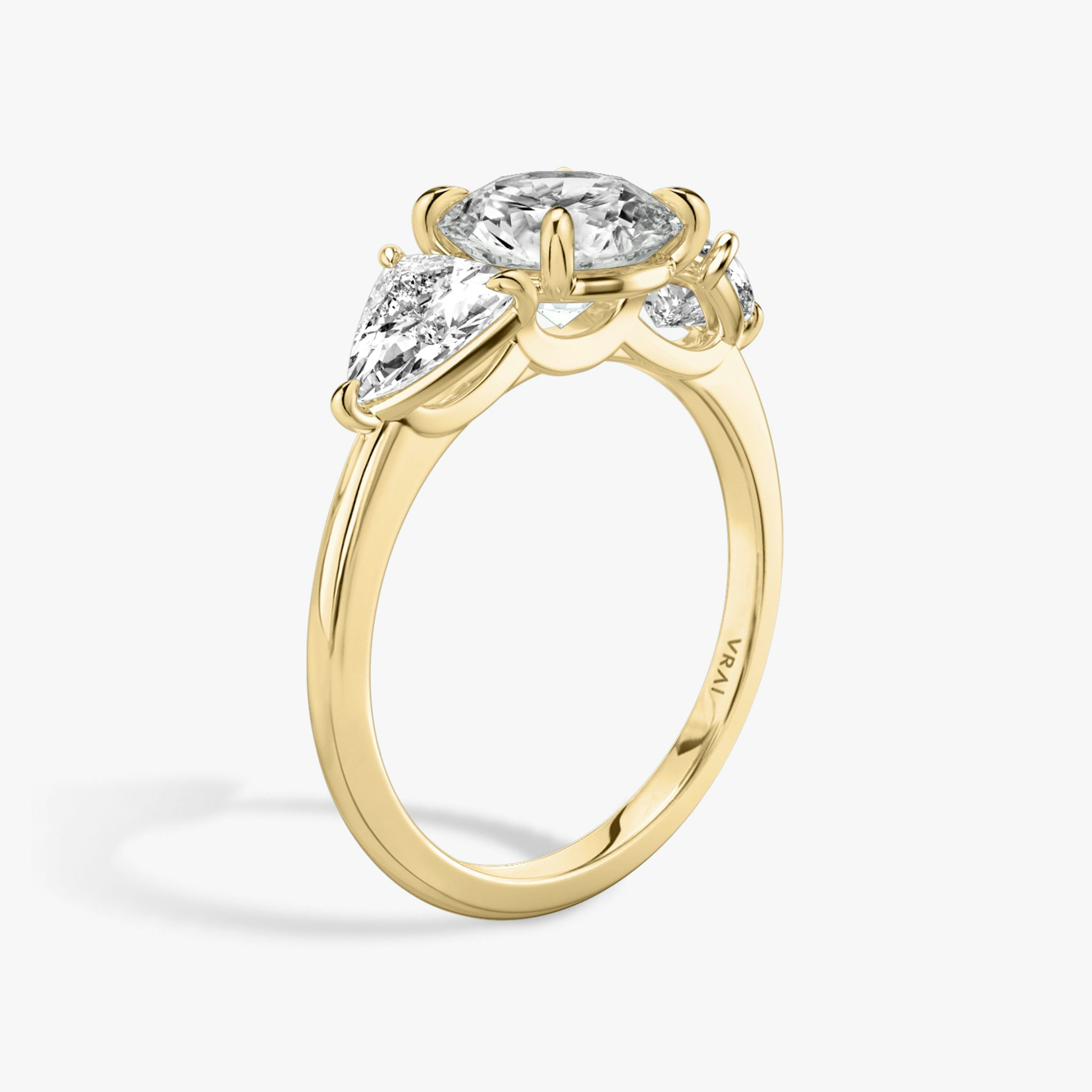 The Three Stone | Round Brilliant | 18k | Yellow Gold | bandAccent: Plain | caratWeight: other | sideStoneCarat: 0.50ct | sideStoneShape: Trillion | diamondOrientation: vertical