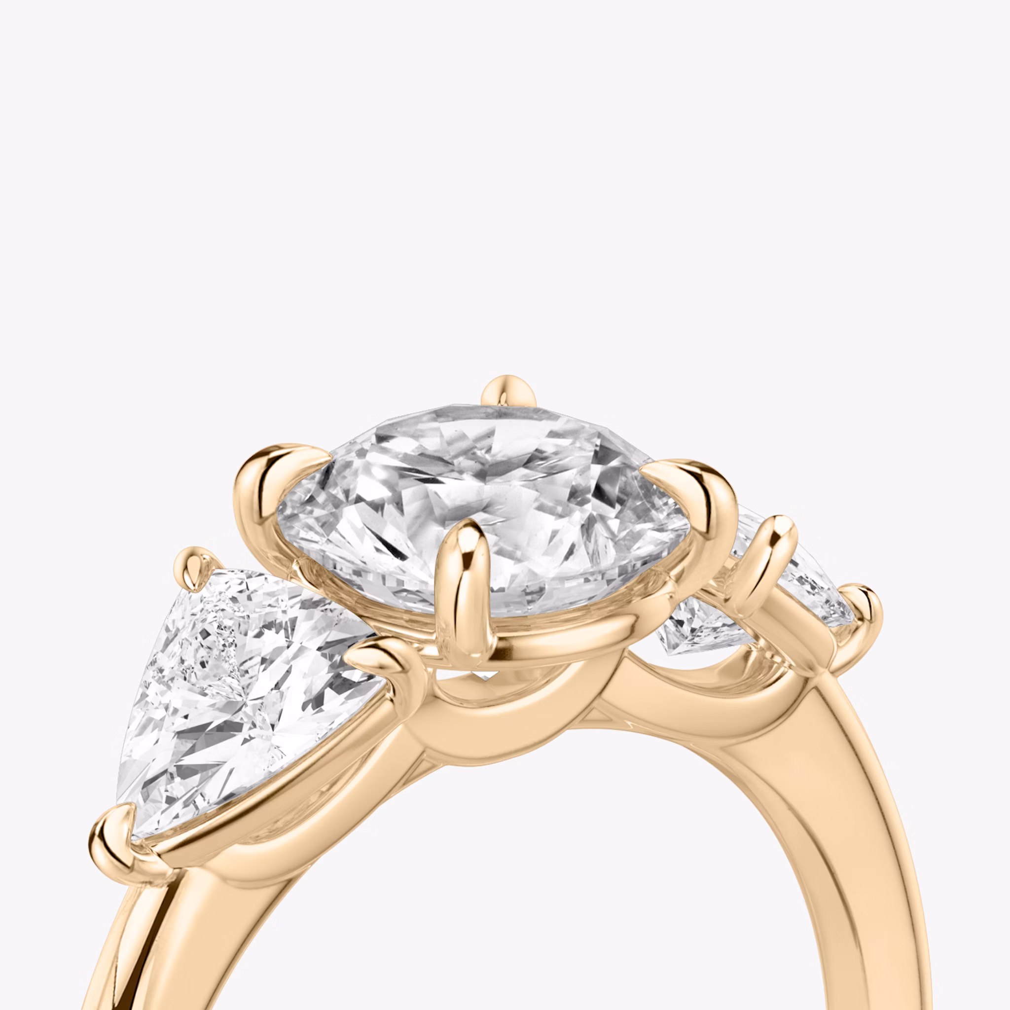 The Three Stone | Round Brilliant | 14k | Rose Gold | bandAccent: Plain | caratWeight: other | sideStoneCarat: 0.50ct | sideStoneShape: Trillion | diamondOrientation: vertical