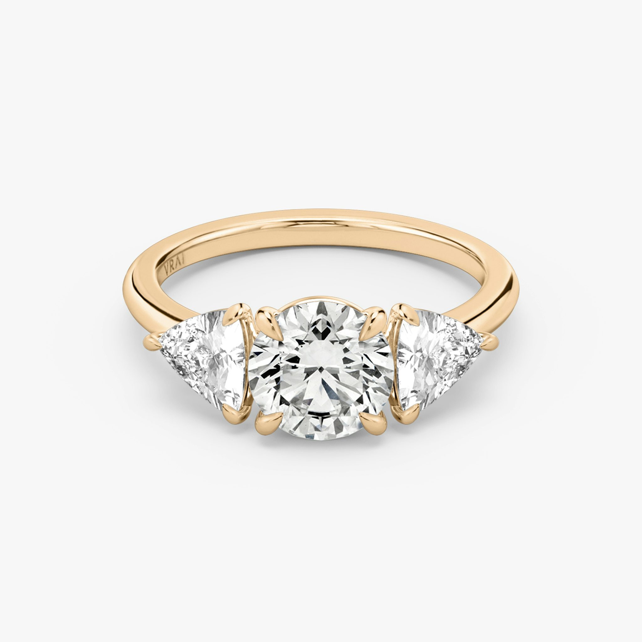 The Three Stone | Round Brilliant | 14k | Rose Gold | bandAccent: Plain | caratWeight: other | sideStoneCarat: 0.50ct | sideStoneShape: Trillion | diamondOrientation: vertical