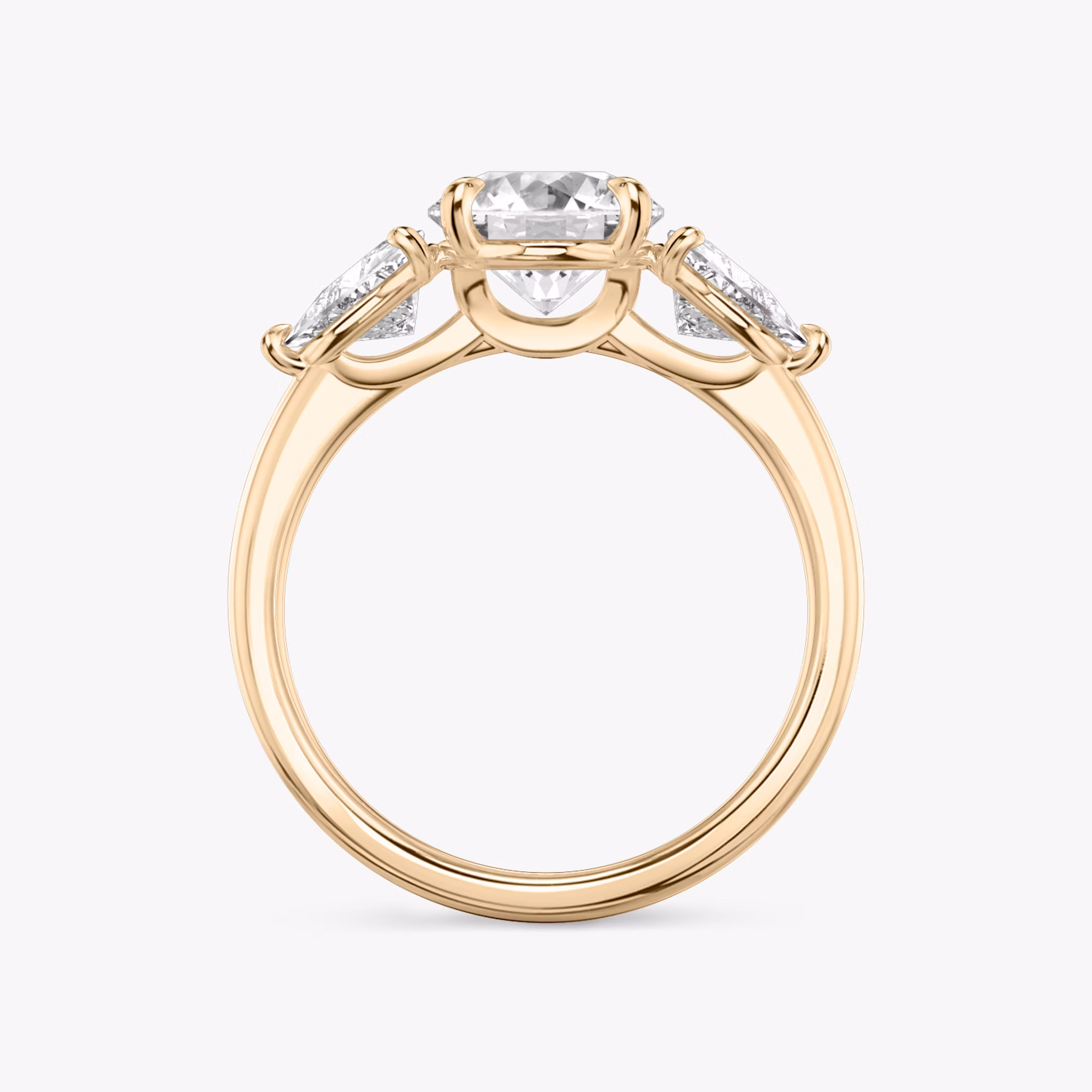 The Three Stone | Round Brilliant | 14k | Rose Gold | bandAccent: Plain | caratWeight: other | sideStoneCarat: 0.50ct | sideStoneShape: Trillion | diamondOrientation: vertical