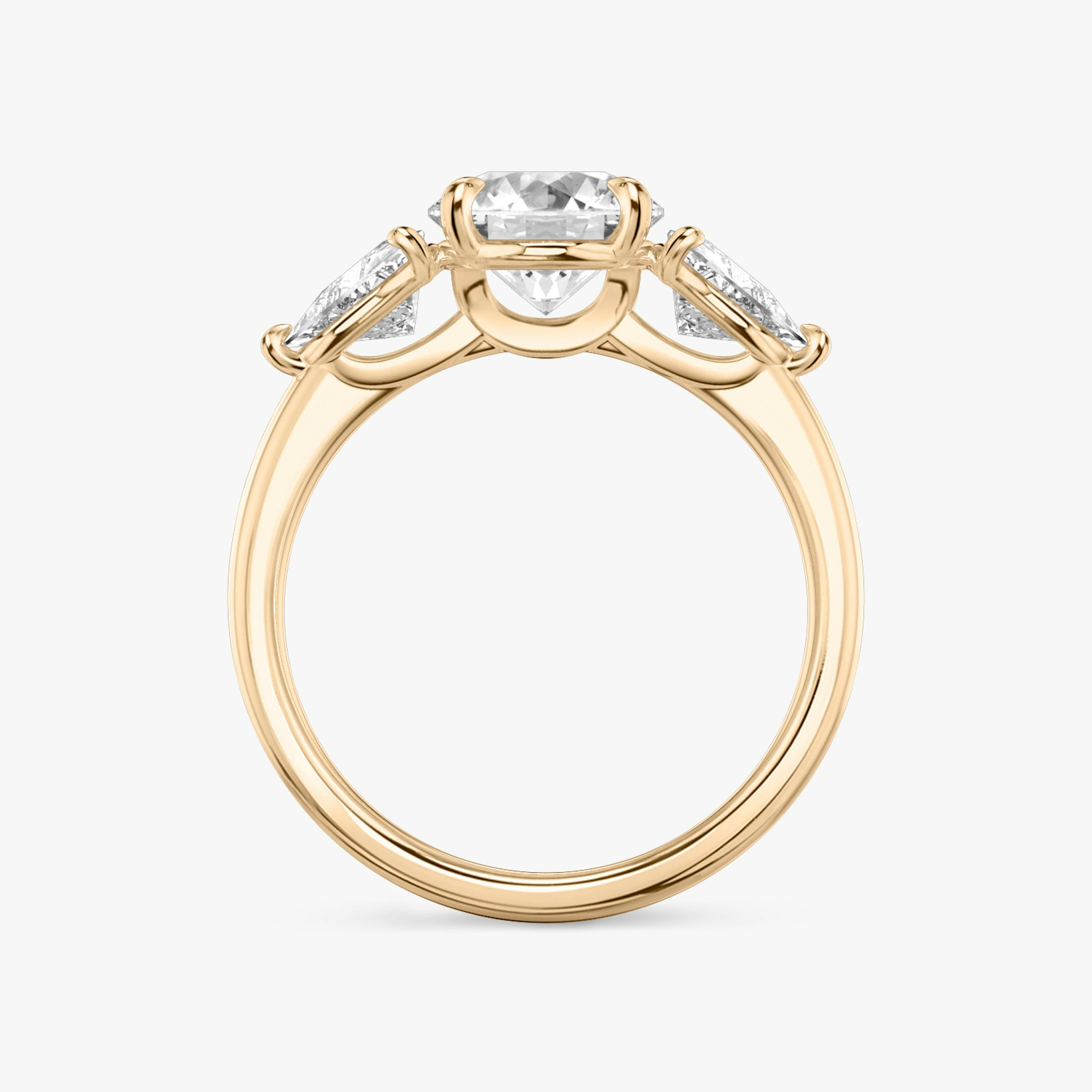 The Three Stone | Round Brilliant | 14k | Rose Gold | bandAccent: Plain | caratWeight: other | sideStoneCarat: 0.50ct | sideStoneShape: Trillion | diamondOrientation: vertical