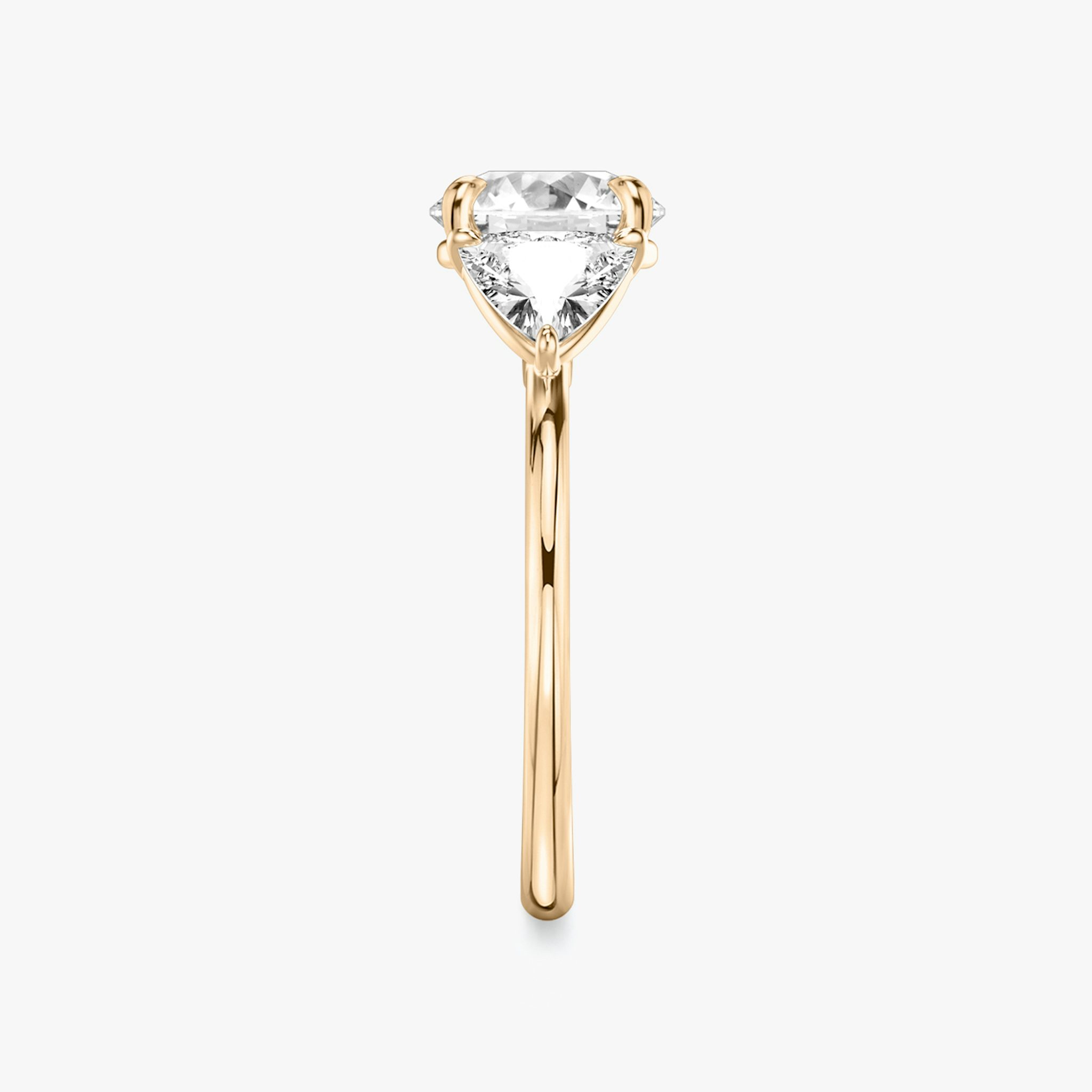 The Three Stone | Round Brilliant | 14k | Rose Gold | bandAccent: Plain | caratWeight: other | sideStoneCarat: 0.50ct | sideStoneShape: Trillion | diamondOrientation: vertical