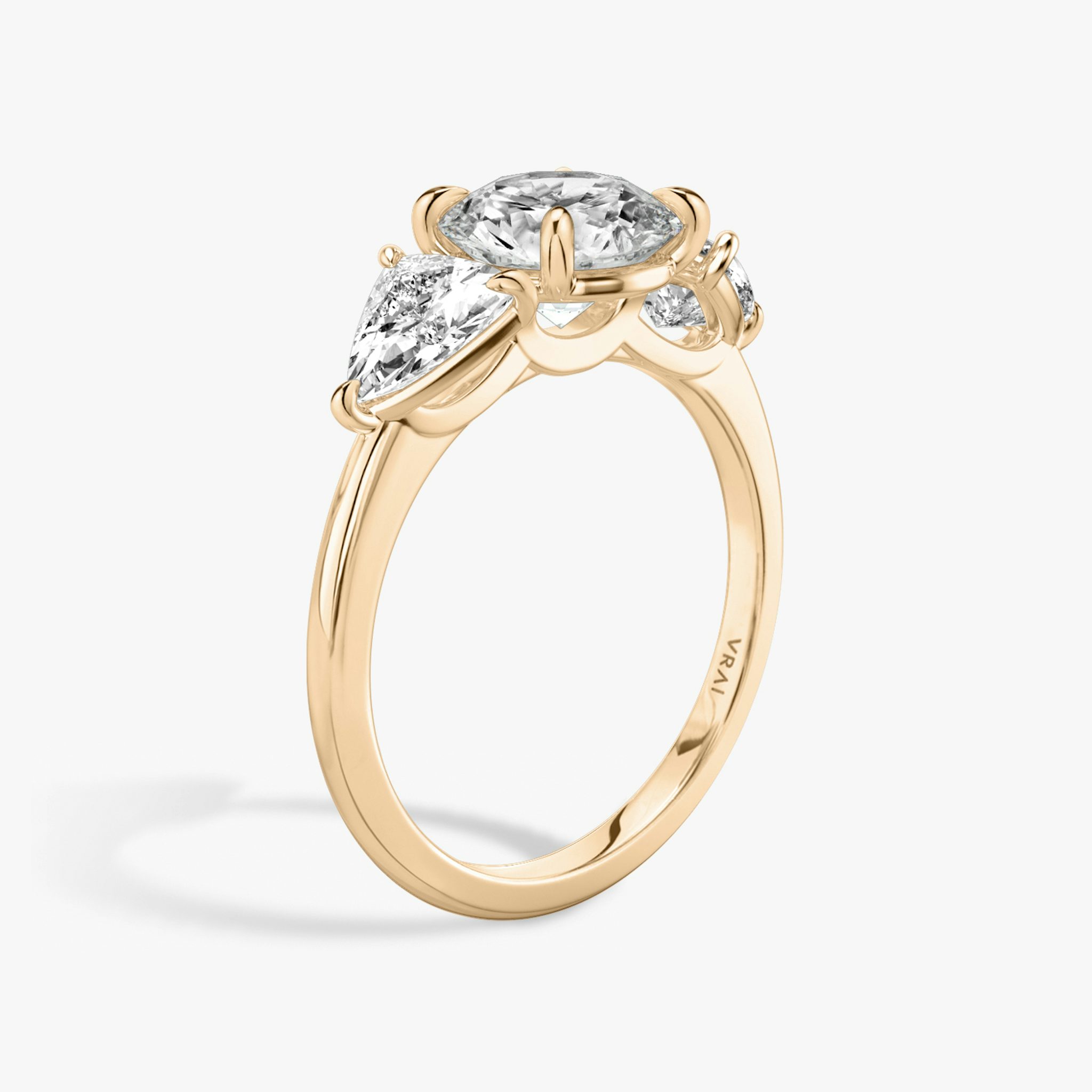 The Three Stone | Round Brilliant | 14k | Rose Gold | bandAccent: Plain | caratWeight: other | sideStoneCarat: 0.50ct | sideStoneShape: Trillion | diamondOrientation: vertical