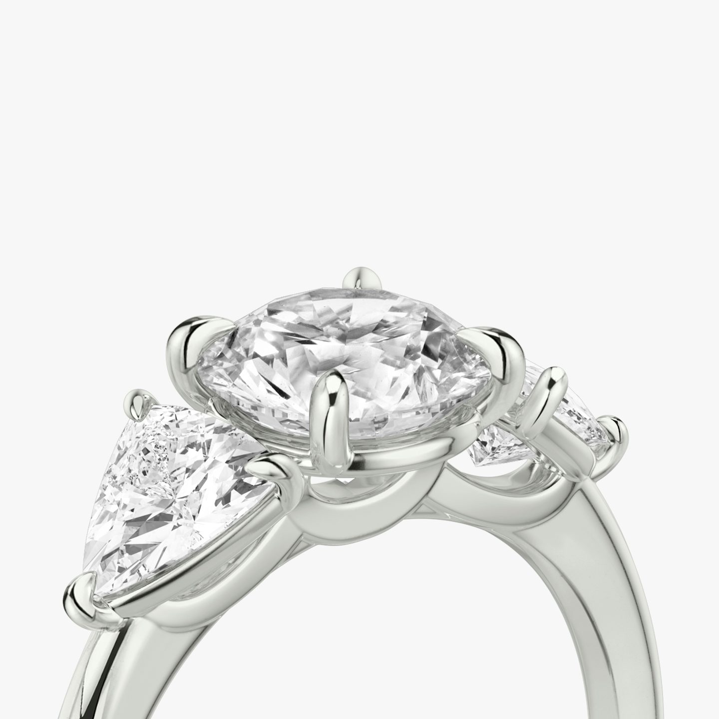 The Three Stone | Round Brilliant | Platinum | bandAccent: Plain | caratWeight: other | sideStoneCarat: 0.50ct | sideStoneShape: Trillion | diamondOrientation: vertical