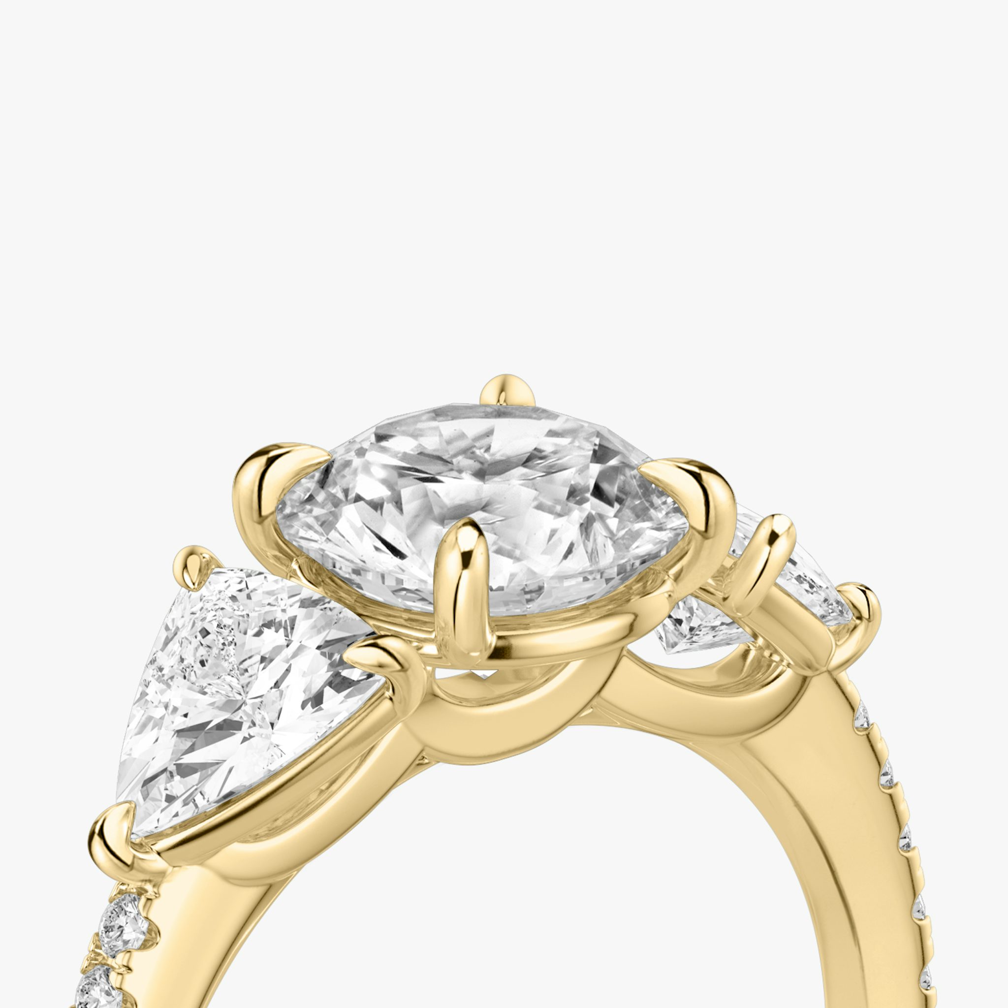 The Three Stone | Round Brilliant | 18k | Yellow Gold | bandAccent: Pavé | caratWeight: other | sideStoneCarat: 0.50ct | sideStoneShape: Trillion | diamondOrientation: vertical