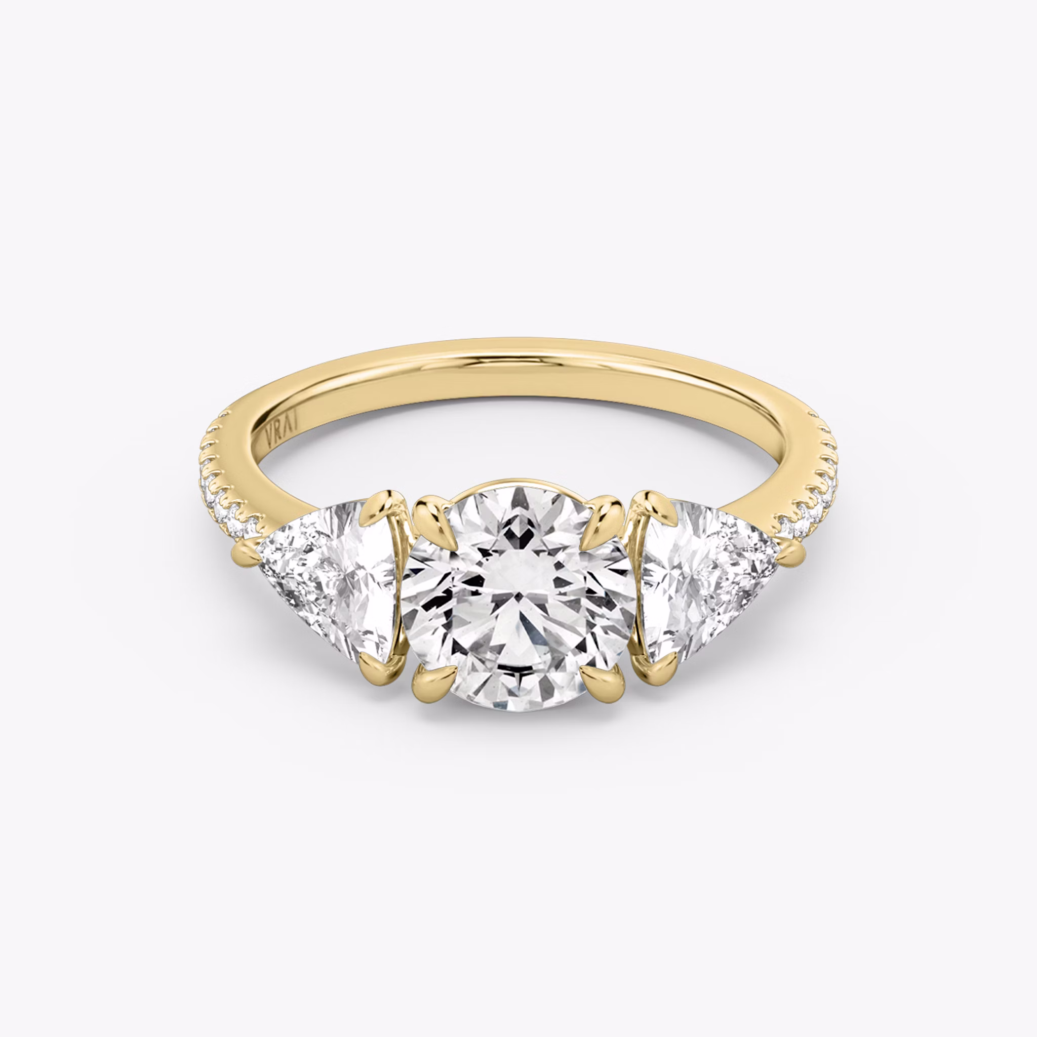 The Three Stone | Round Brilliant | 18k | Yellow Gold | bandAccent: Pavé | caratWeight: other | sideStoneCarat: 0.50ct | sideStoneShape: Trillion | diamondOrientation: vertical