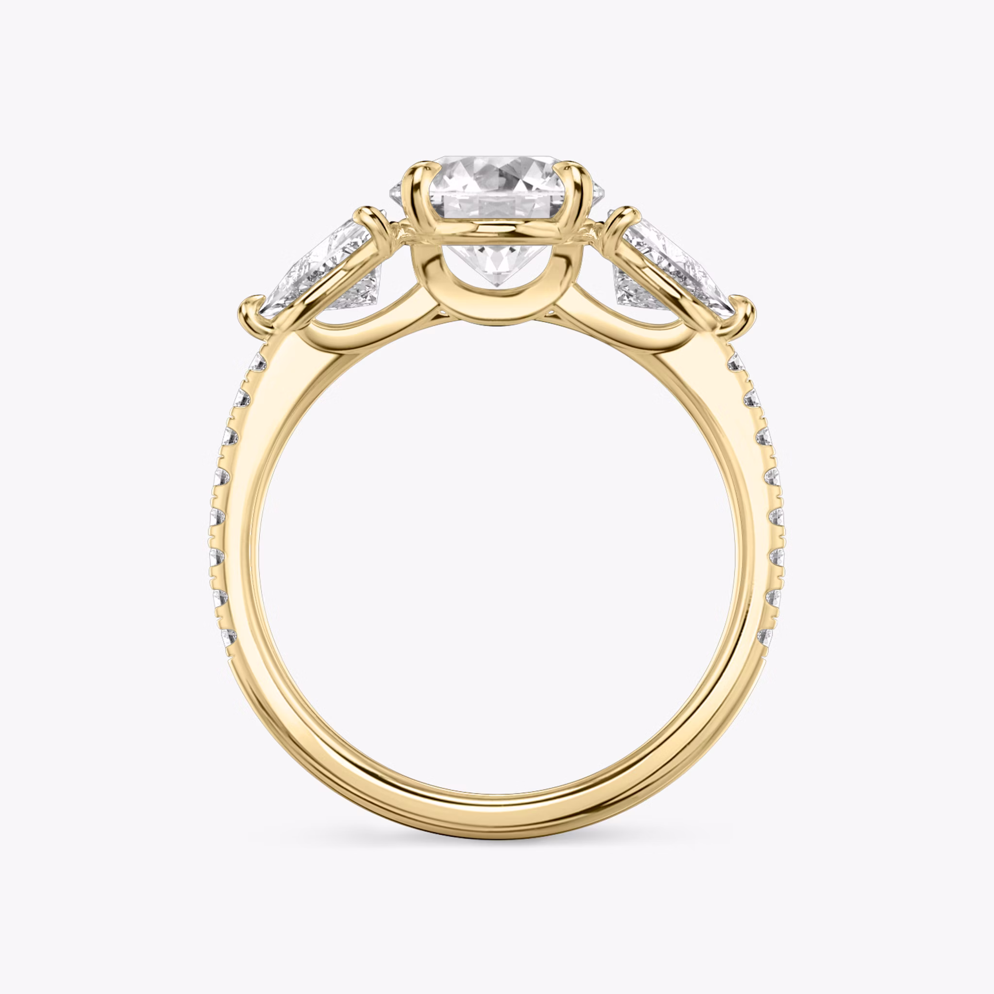 The Three Stone | Round Brilliant | 18k | Yellow Gold | bandAccent: Pavé | caratWeight: other | sideStoneCarat: 0.50ct | sideStoneShape: Trillion | diamondOrientation: vertical