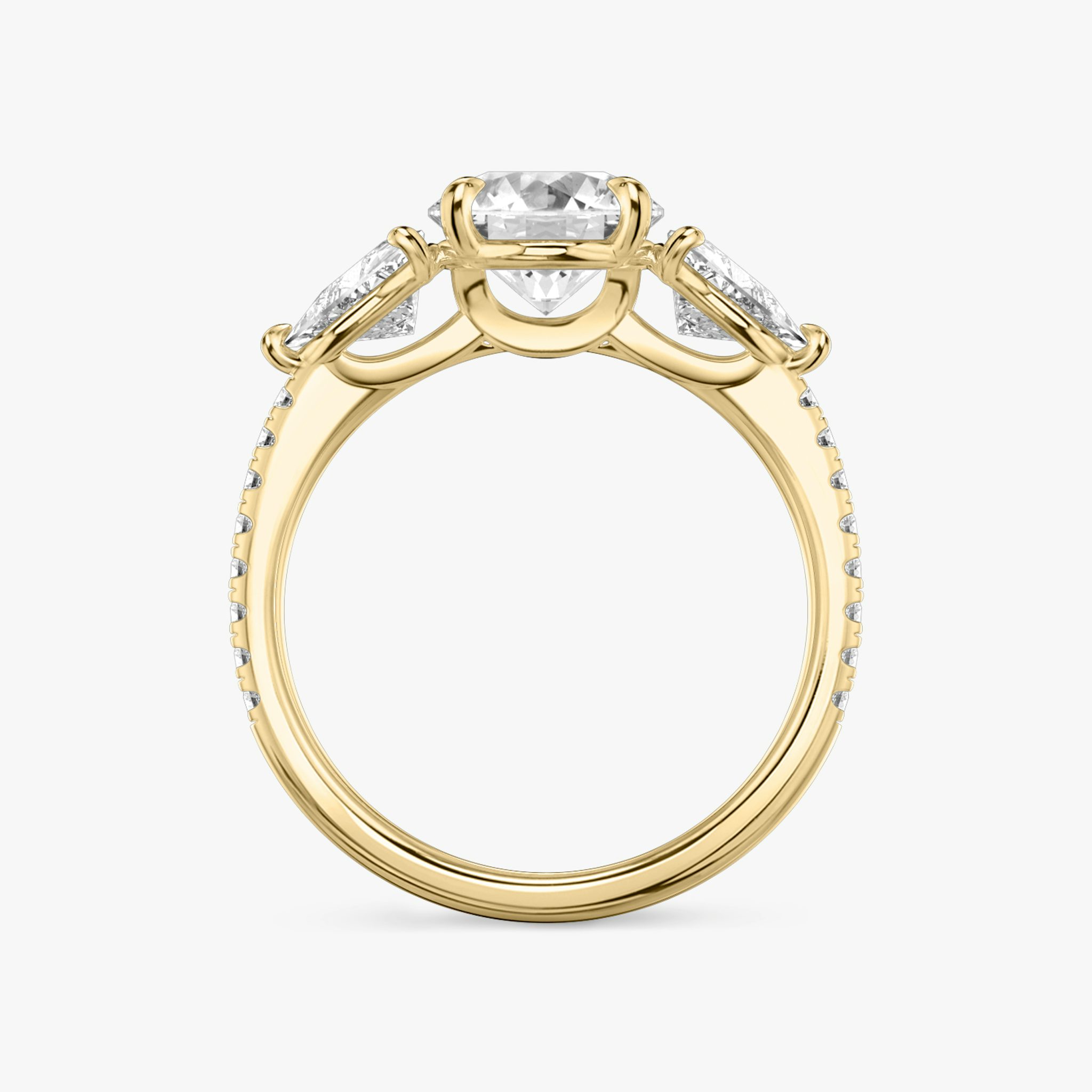 The Three Stone | Round Brilliant | 18k | Yellow Gold | bandAccent: Pavé | caratWeight: other | sideStoneCarat: 0.50ct | sideStoneShape: Trillion | diamondOrientation: vertical