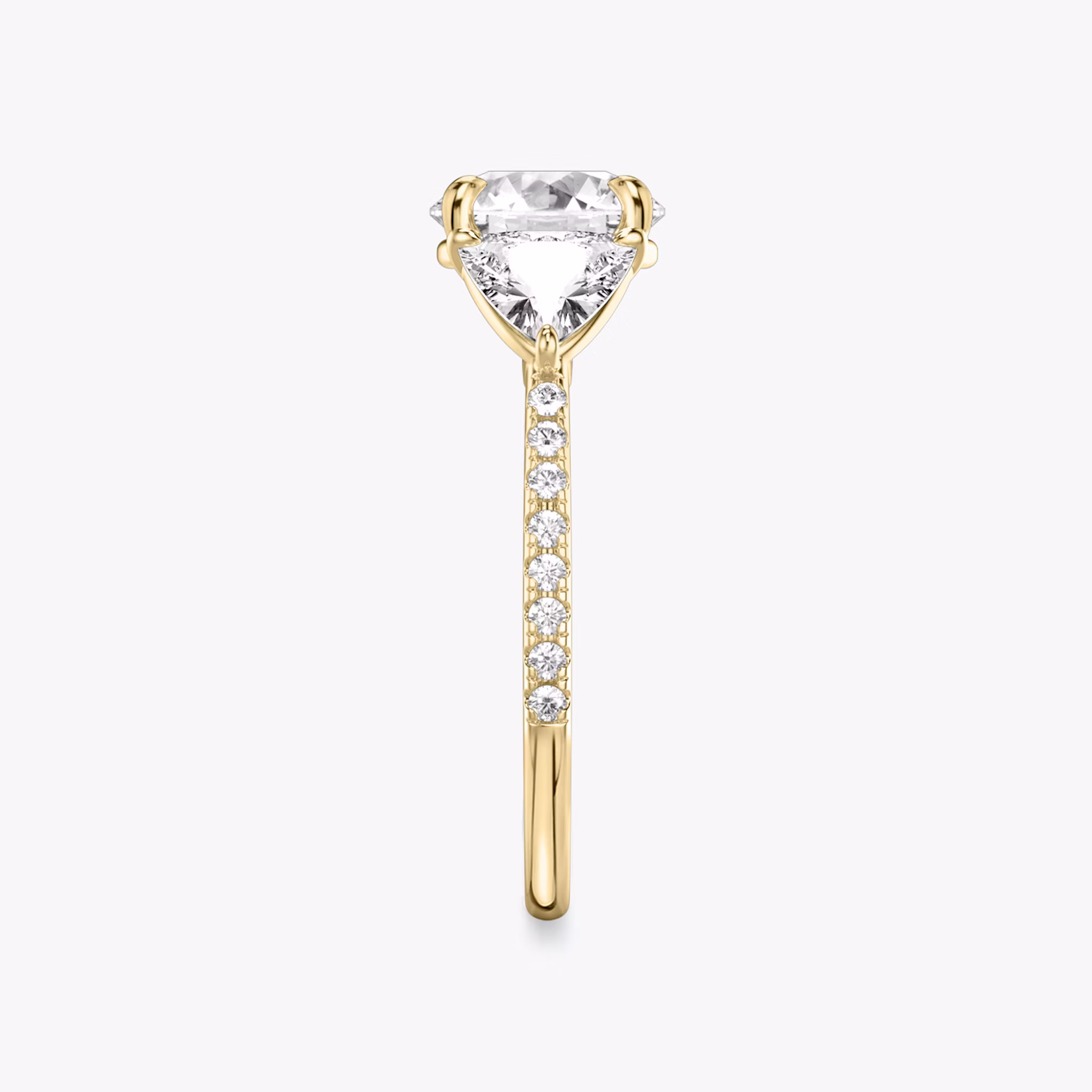 The Three Stone | Round Brilliant | 18k | Yellow Gold | bandAccent: Pavé | caratWeight: other | sideStoneCarat: 0.50ct | sideStoneShape: Trillion | diamondOrientation: vertical