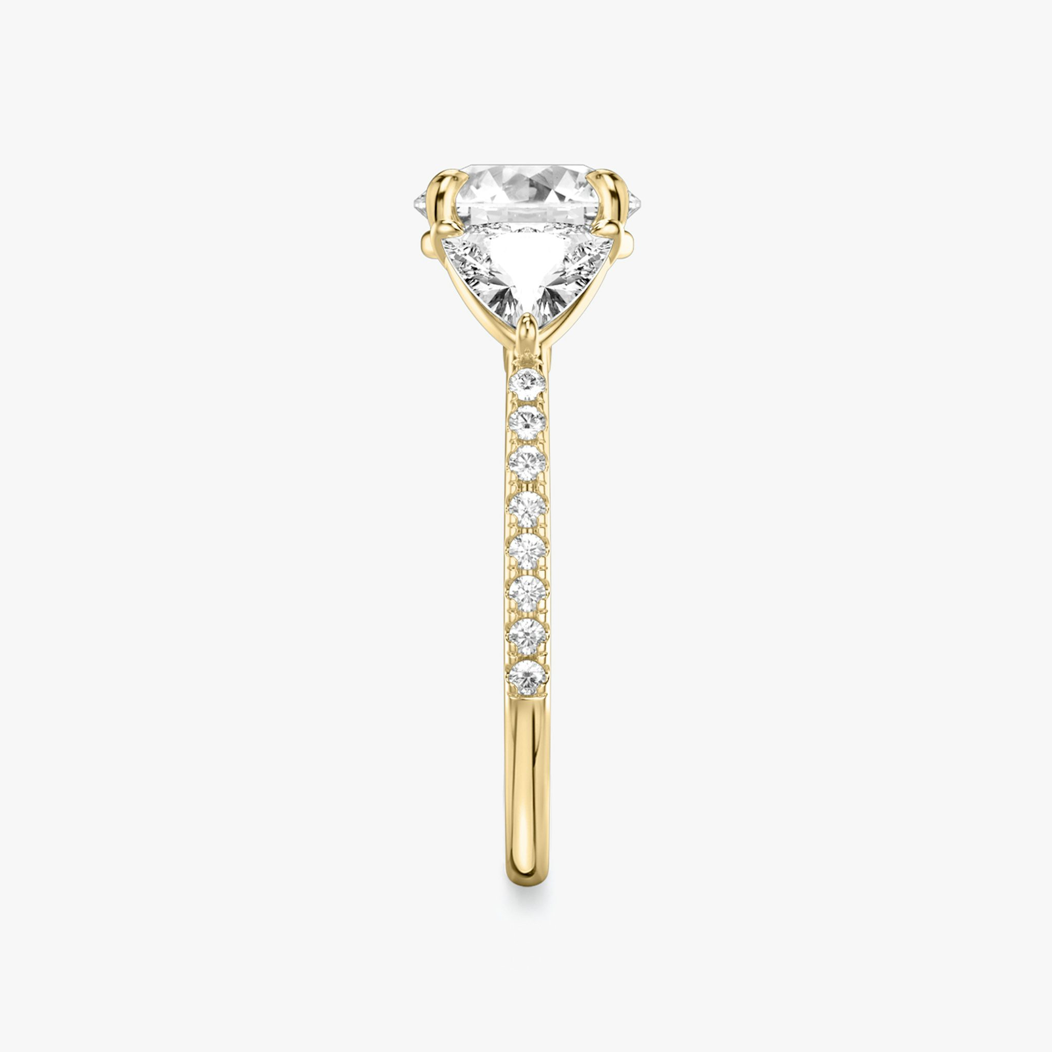 The Three Stone | Round Brilliant | 18k | Yellow Gold | bandAccent: Pavé | caratWeight: other | sideStoneCarat: 0.50ct | sideStoneShape: Trillion | diamondOrientation: vertical