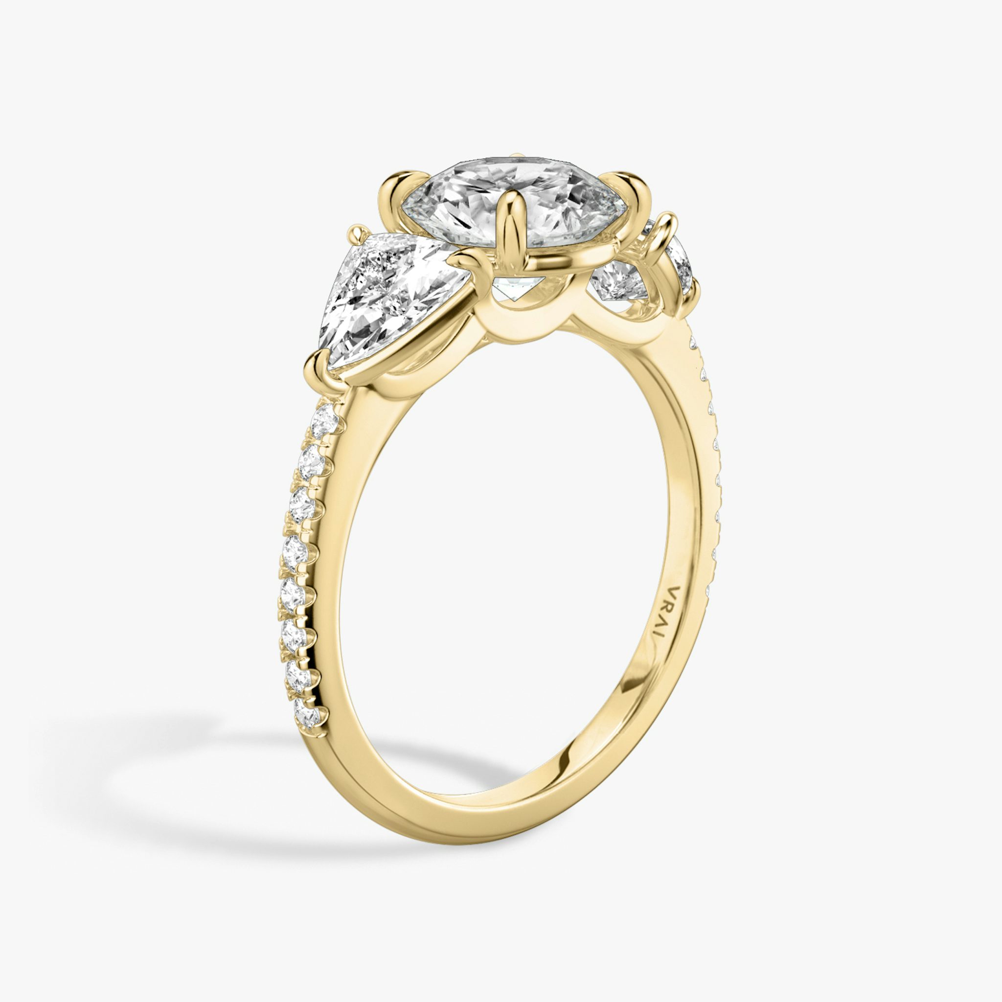 The Three Stone | Round Brilliant | 18k | Yellow Gold | bandAccent: Pavé | caratWeight: other | sideStoneCarat: 0.50ct | sideStoneShape: Trillion | diamondOrientation: vertical
