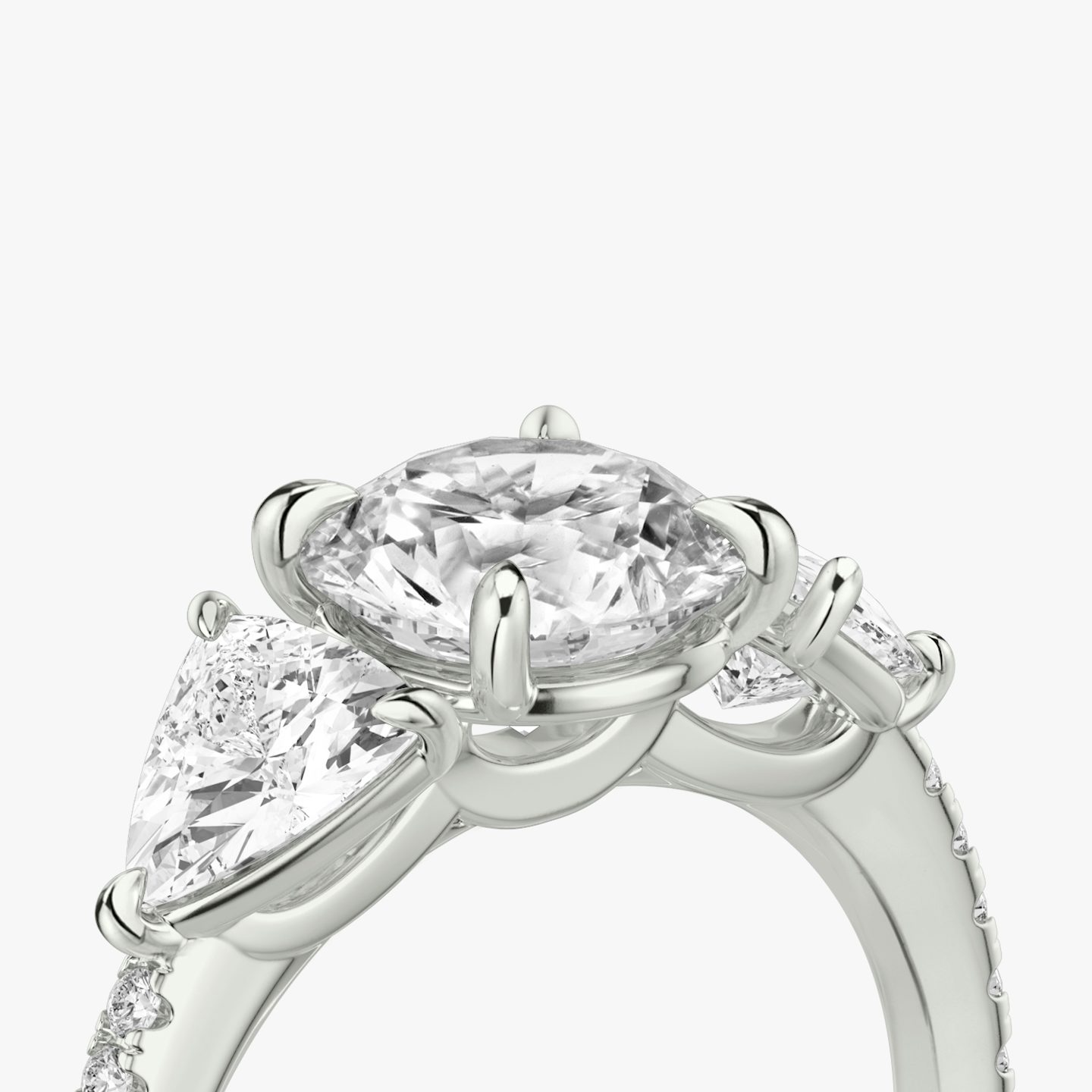 The Three Stone | Round Brilliant | 18k | White Gold | bandAccent: Pavé | caratWeight: other | sideStoneCarat: 0.50ct | sideStoneShape: Trillion | diamondOrientation: vertical