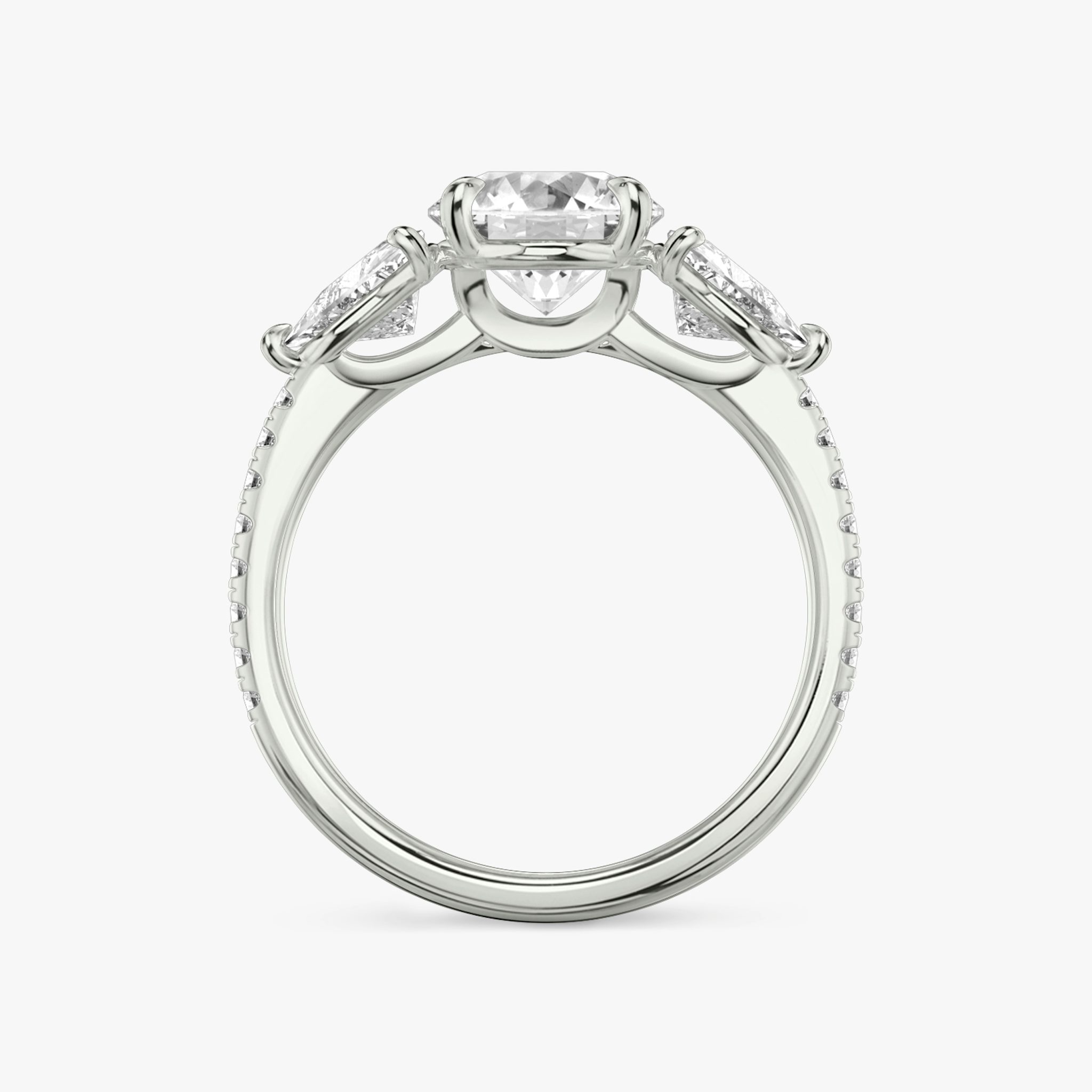 The Three Stone | Round Brilliant | 18k | White Gold | bandAccent: Pavé | caratWeight: other | sideStoneCarat: 0.50ct | sideStoneShape: Trillion | diamondOrientation: vertical