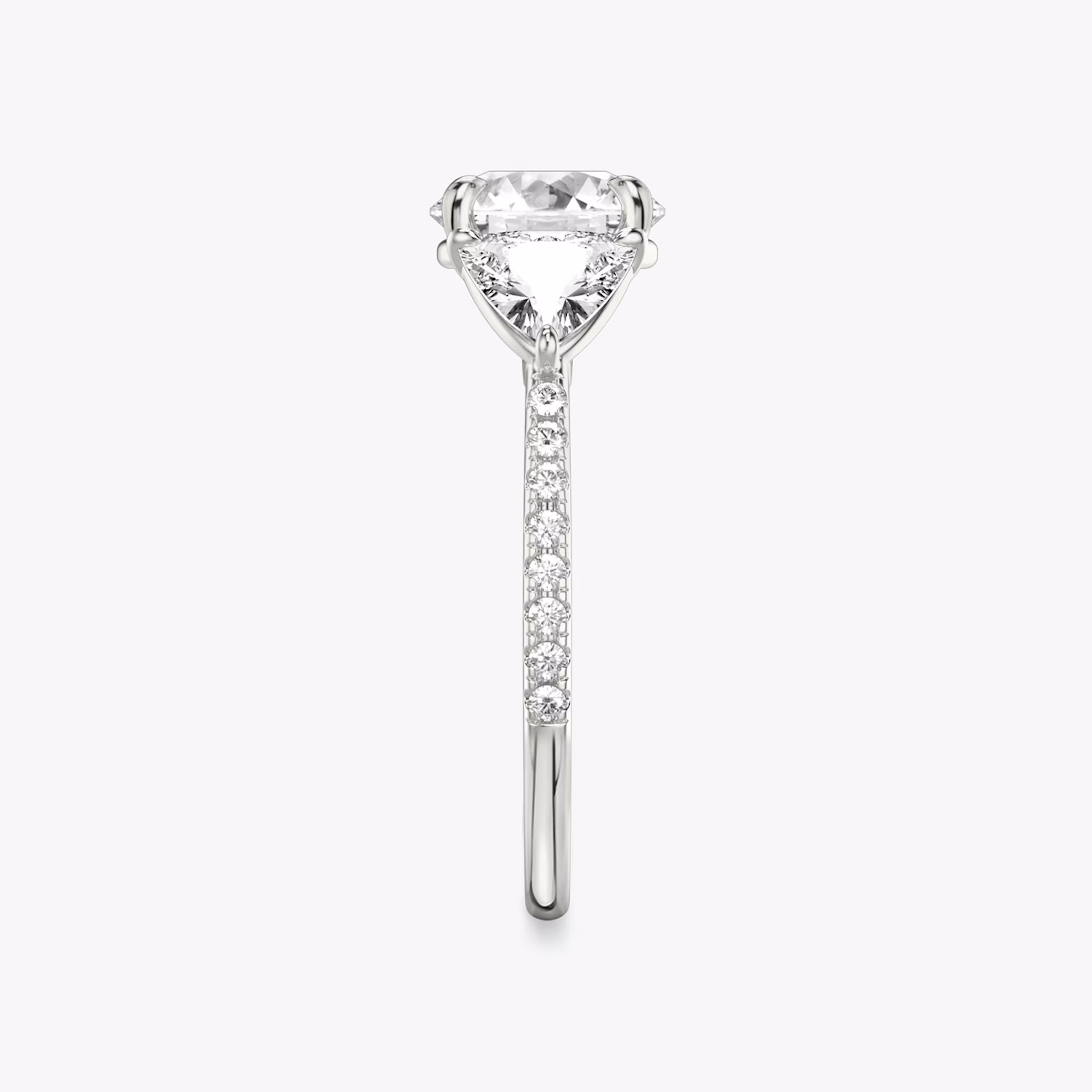 The Three Stone | Round Brilliant | 18k | White Gold | bandAccent: Pavé | caratWeight: other | sideStoneCarat: 0.50ct | sideStoneShape: Trillion | diamondOrientation: vertical