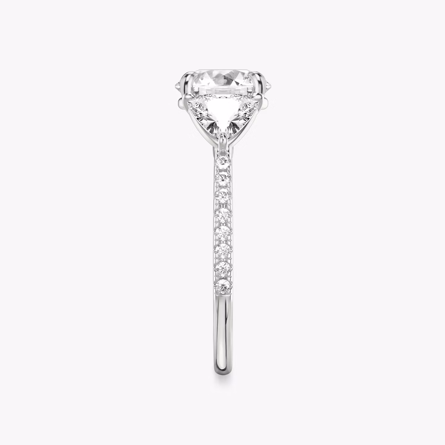 The Three Stone | Round Brilliant | 18k | White Gold | bandAccent: Pavé | caratWeight: other | sideStoneCarat: 0.50ct | sideStoneShape: Trillion | diamondOrientation: vertical