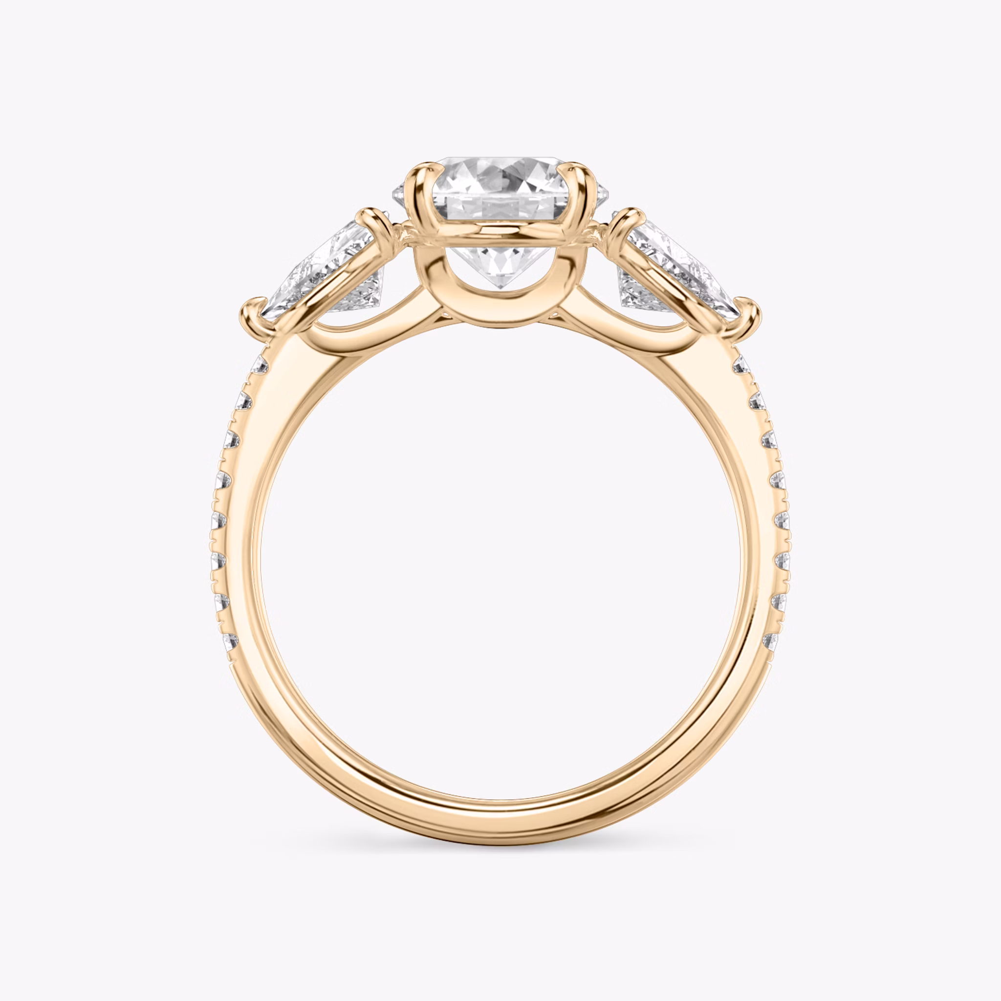 The Three Stone | Round Brilliant | 14k | Rose Gold | bandAccent: Pavé | caratWeight: other | sideStoneCarat: 0.50ct | sideStoneShape: Trillion | diamondOrientation: vertical