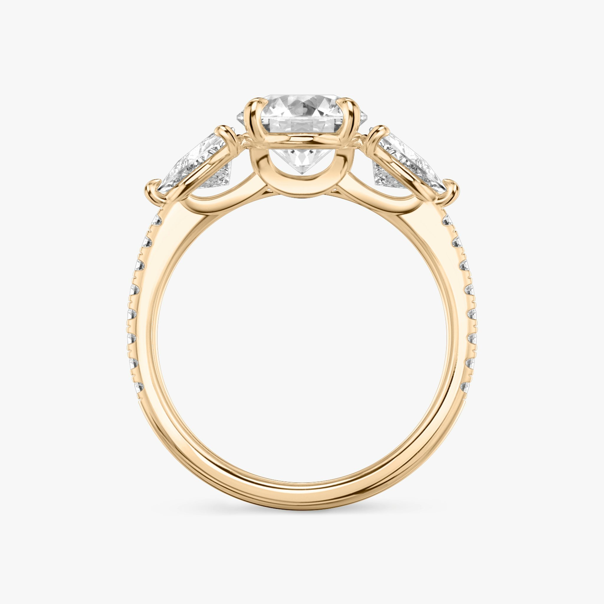 The Three Stone | Round Brilliant | 14k | Rose Gold | bandAccent: Pavé | caratWeight: other | sideStoneCarat: 0.50ct | sideStoneShape: Trillion | diamondOrientation: vertical