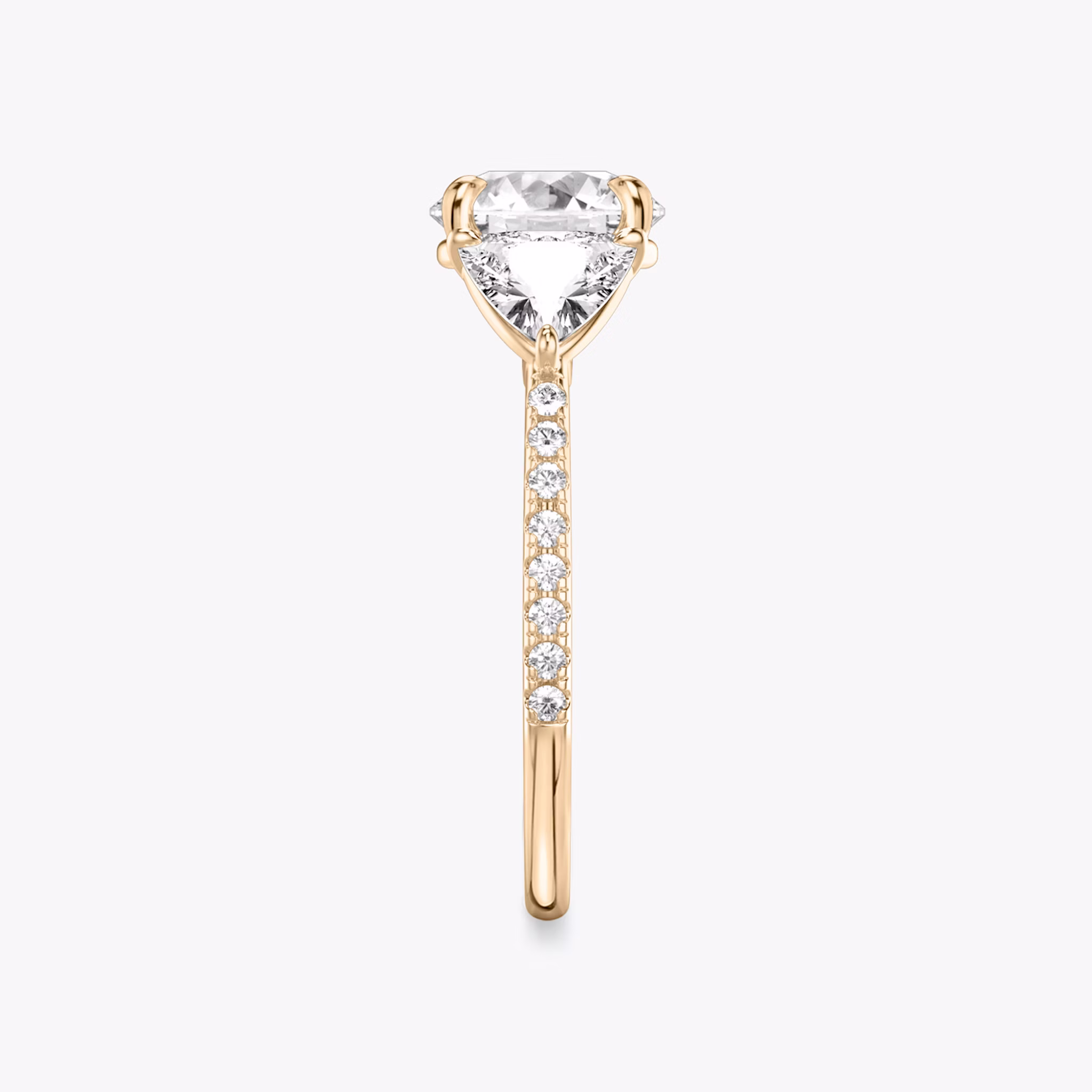The Three Stone | Round Brilliant | 14k | Rose Gold | bandAccent: Pavé | caratWeight: other | sideStoneCarat: 0.50ct | sideStoneShape: Trillion | diamondOrientation: vertical