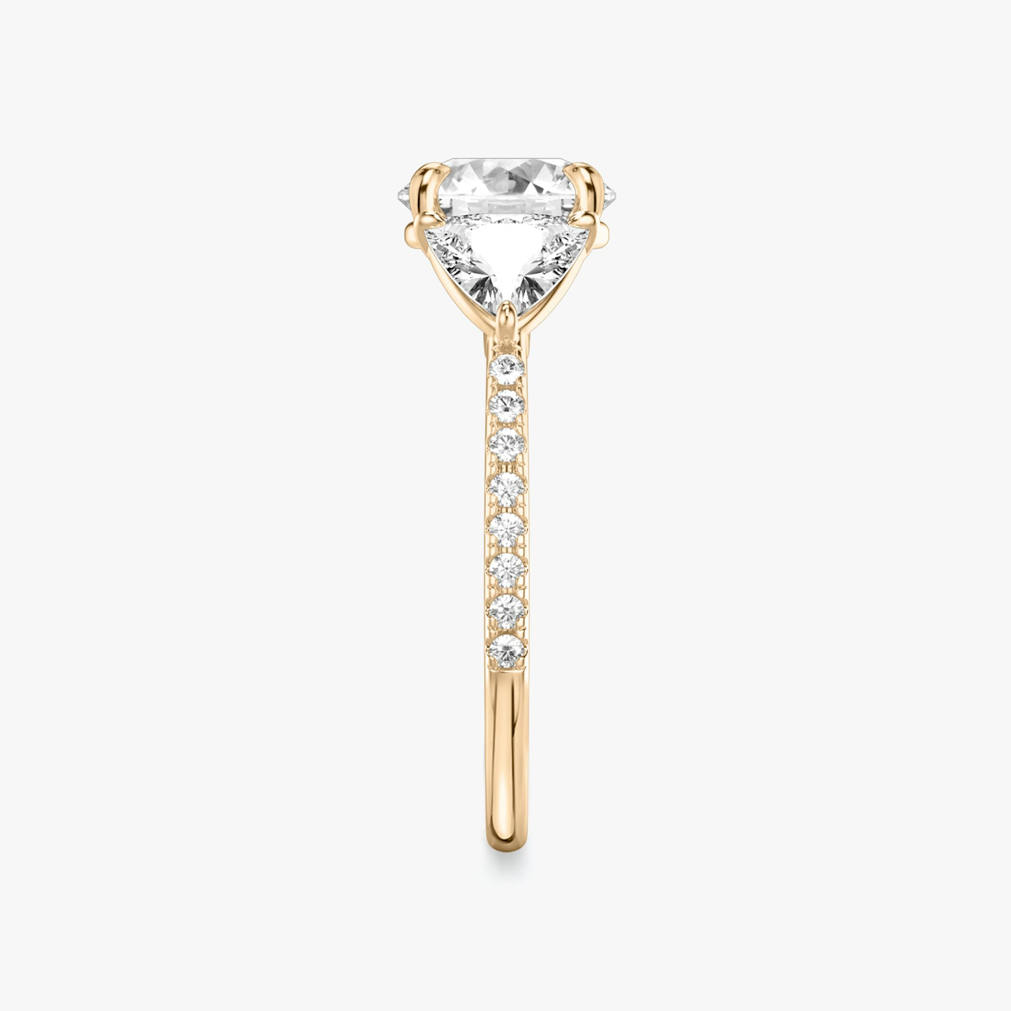 The Three Stone | Round Brilliant | 14k | Rose Gold | bandAccent: Pavé | caratWeight: other | sideStoneCarat: 0.50ct | sideStoneShape: Trillion | diamondOrientation: vertical