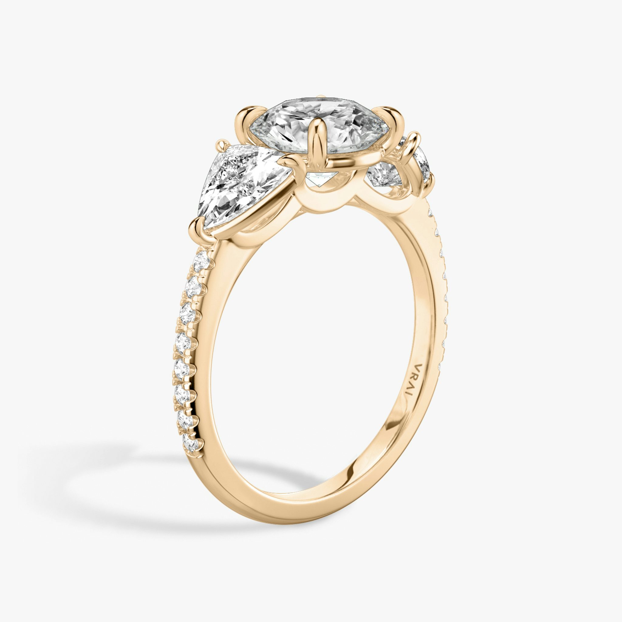 The Three Stone | Round Brilliant | 14k | Rose Gold | bandAccent: Pavé | caratWeight: other | sideStoneCarat: 0.50ct | sideStoneShape: Trillion | diamondOrientation: vertical