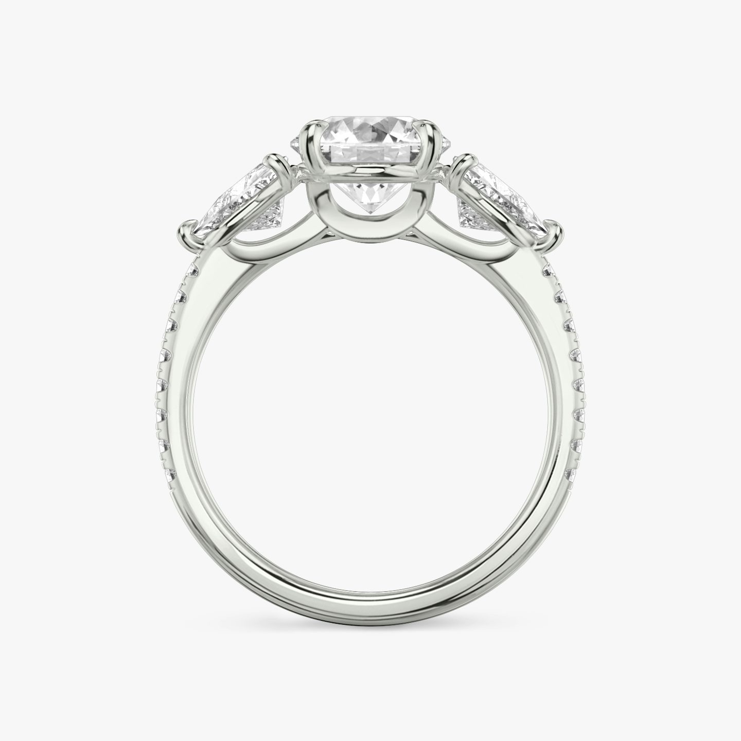 The Three Stone | Round Brilliant | Platinum | bandAccent: Pavé | caratWeight: other | sideStoneCarat: 0.50ct | sideStoneShape: Trillion | diamondOrientation: vertical