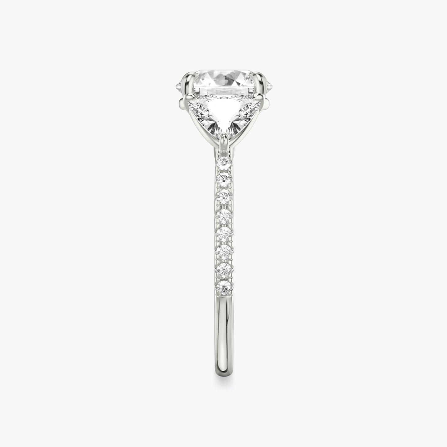 The Three Stone | Round Brilliant | Platinum | bandAccent: Pavé | caratWeight: other | sideStoneCarat: 0.50ct | sideStoneShape: Trillion | diamondOrientation: vertical