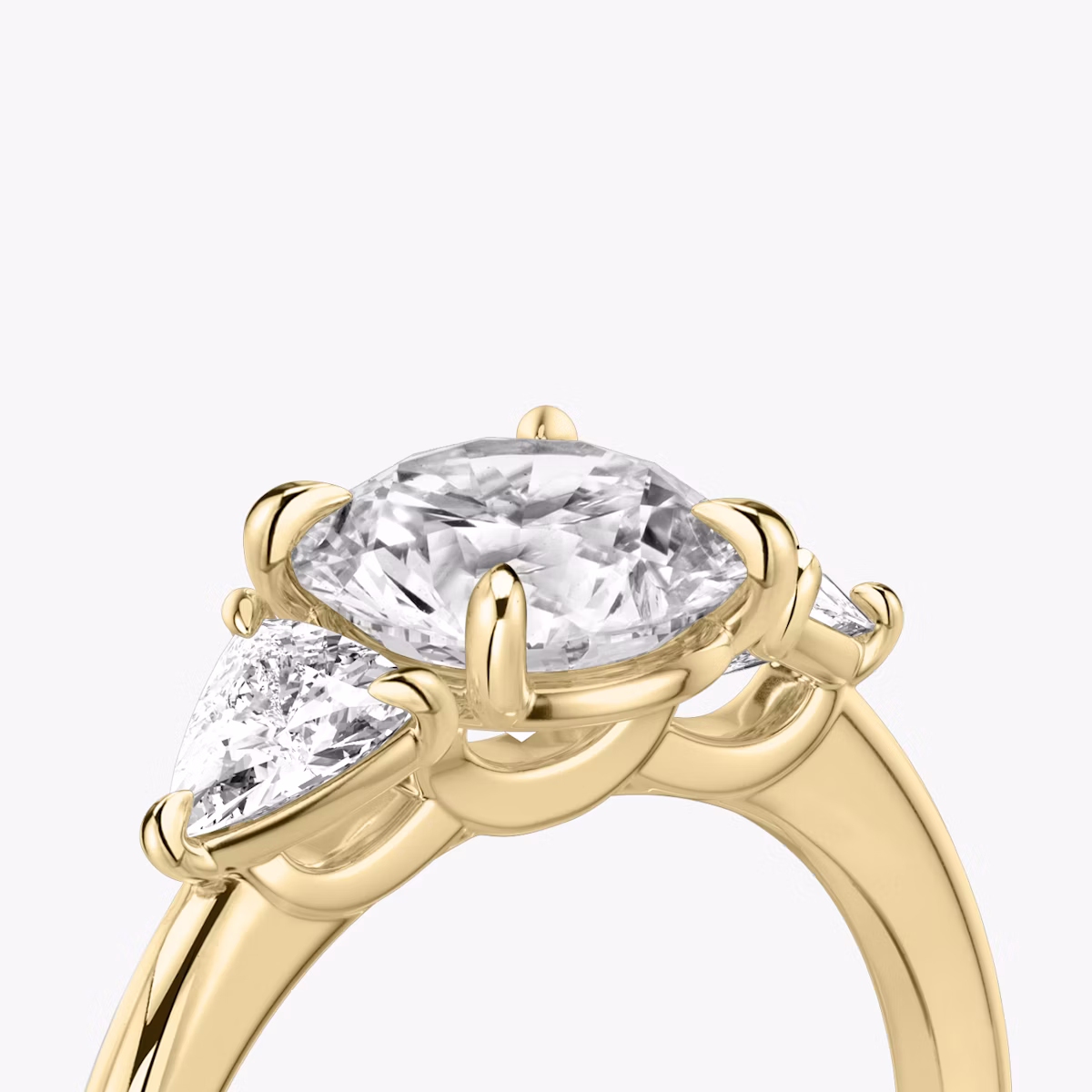 The Three Stone | Round Brilliant | 18k | Yellow Gold | bandAccent: Plain | caratWeight: other | sideStoneCarat: 0.25ct | sideStoneShape: Trillion | diamondOrientation: vertical
