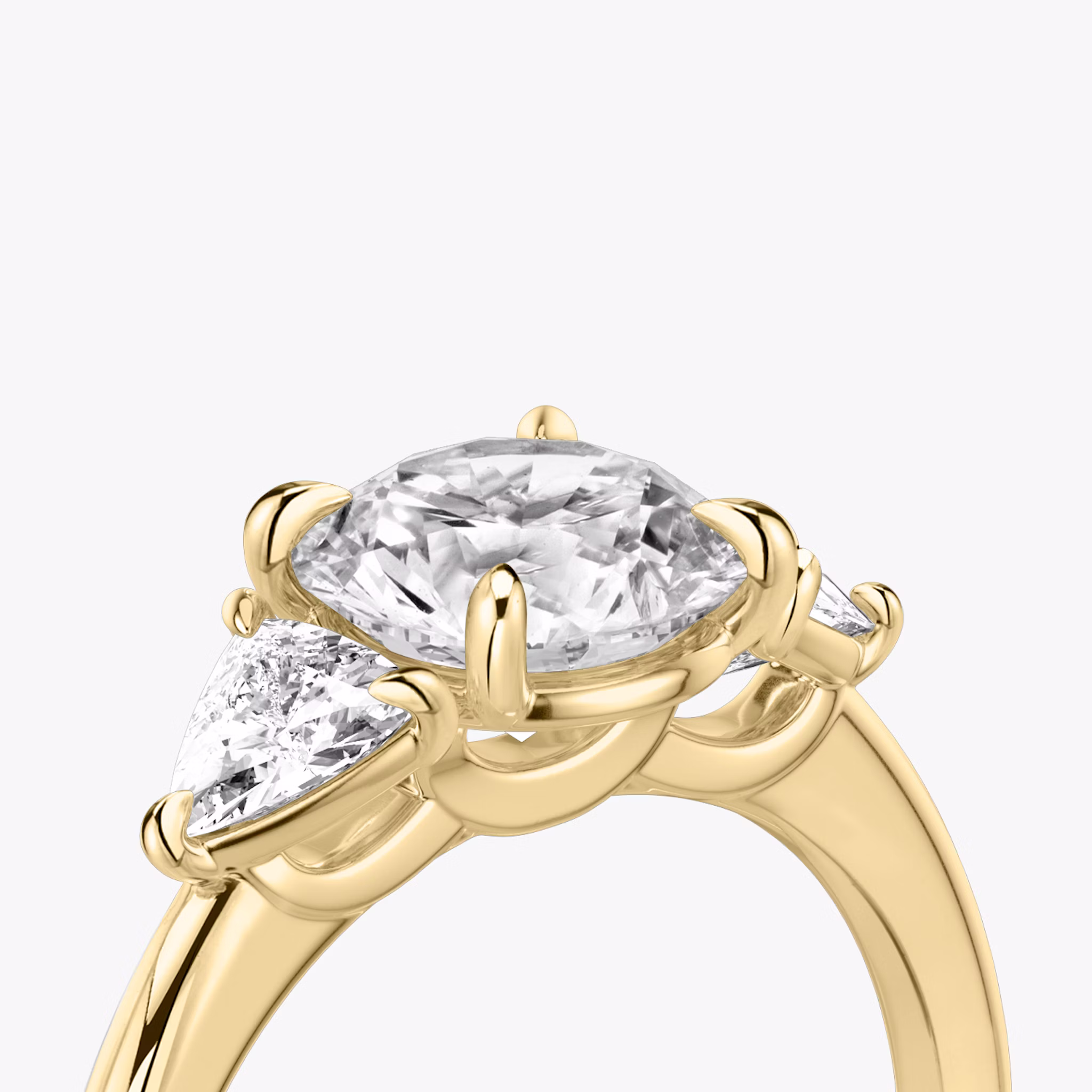 The Three Stone | Round Brilliant | 18k | Yellow Gold | bandAccent: Plain | caratWeight: other | sideStoneCarat: 0.25ct | sideStoneShape: Trillion | diamondOrientation: vertical