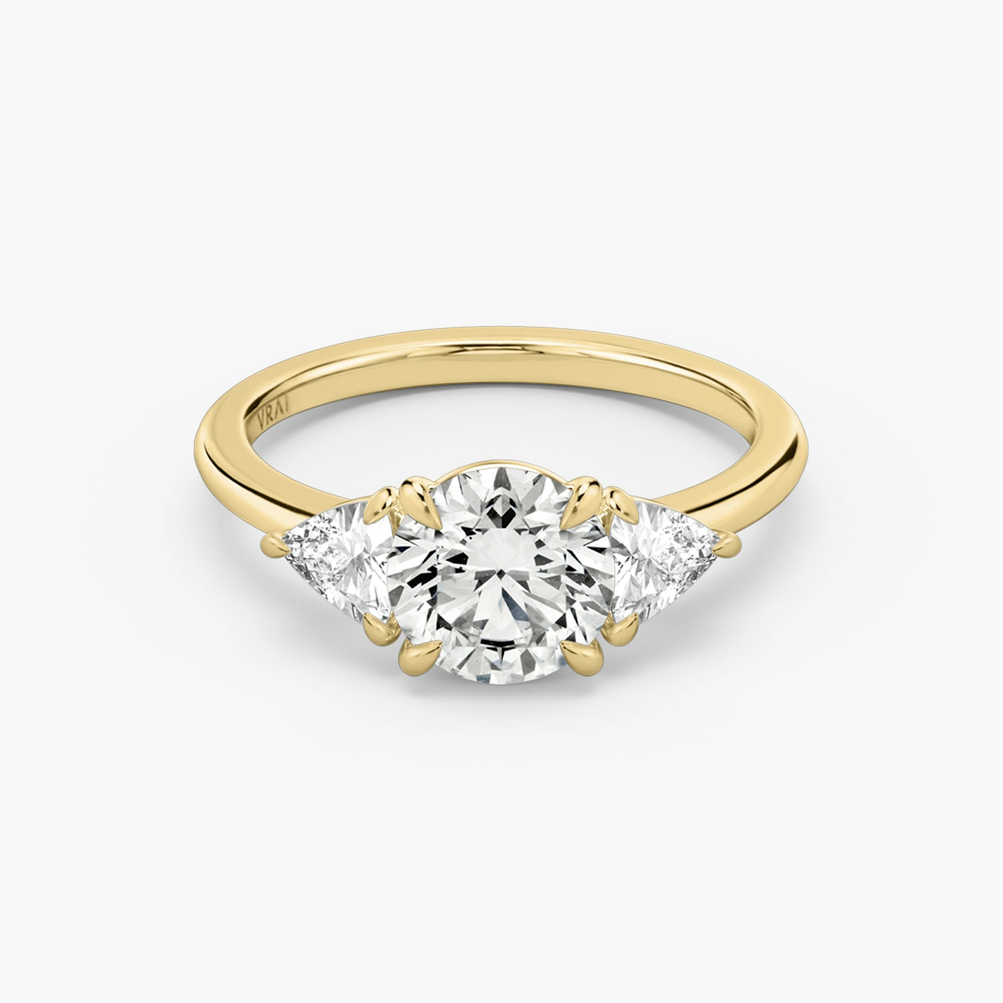 The Three Stone | Round Brilliant | 18k | Yellow Gold | bandAccent: Plain | caratWeight: other | sideStoneCarat: 0.25ct | sideStoneShape: Trillion | diamondOrientation: vertical