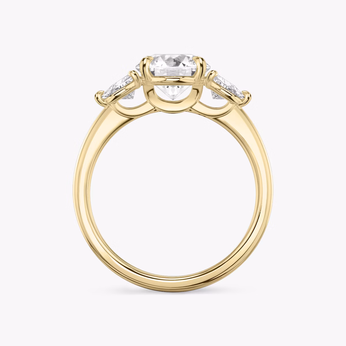 The Three Stone | Round Brilliant | 18k | Yellow Gold | bandAccent: Plain | caratWeight: other | sideStoneCarat: 0.25ct | sideStoneShape: Trillion | diamondOrientation: vertical