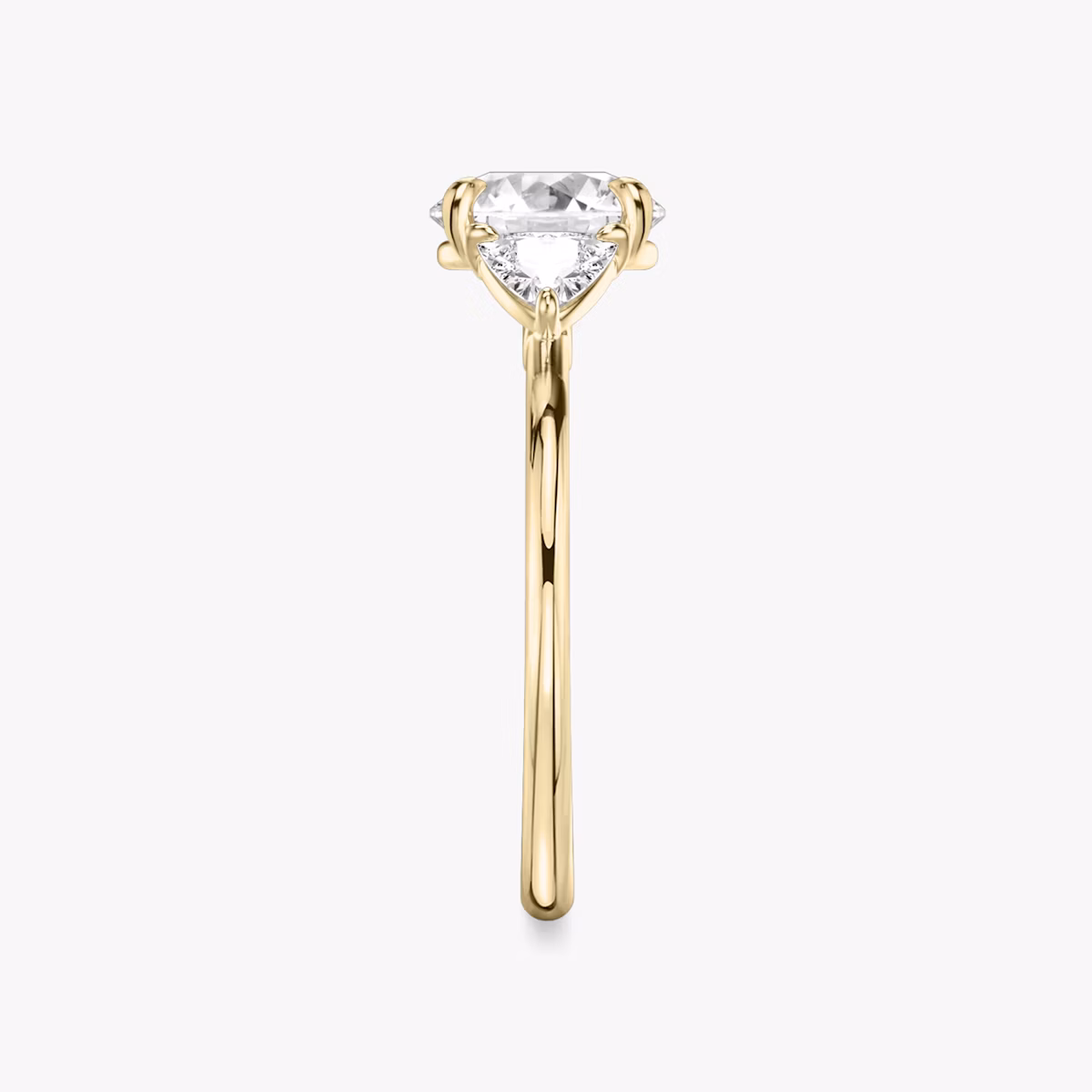 The Three Stone | Round Brilliant | 18k | Yellow Gold | bandAccent: Plain | caratWeight: other | sideStoneCarat: 0.25ct | sideStoneShape: Trillion | diamondOrientation: vertical