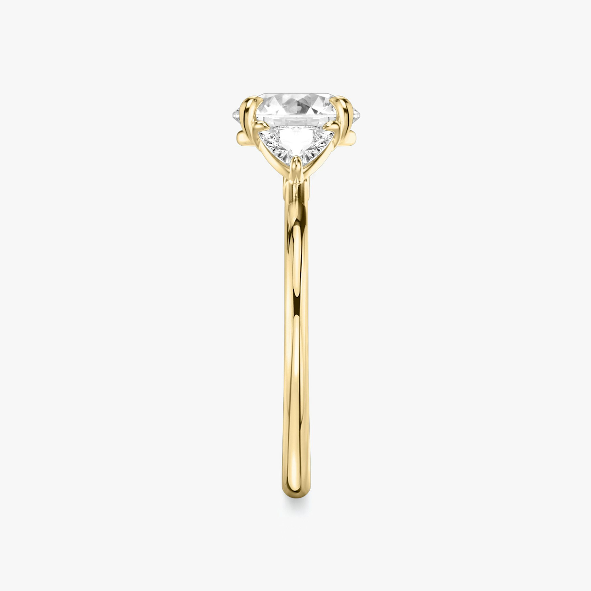 The Three Stone | Round Brilliant | 18k | Yellow Gold | bandAccent: Plain | caratWeight: other | sideStoneCarat: 0.25ct | sideStoneShape: Trillion | diamondOrientation: vertical