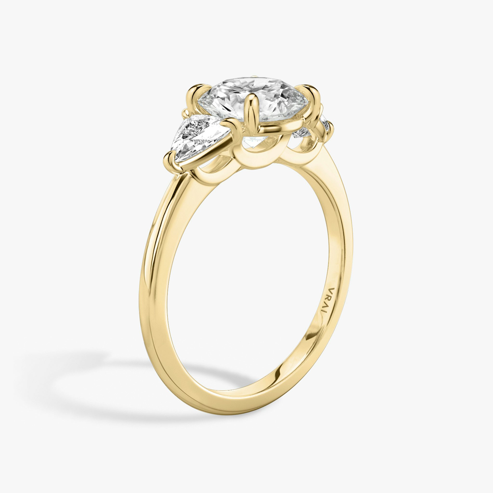 The Three Stone | Round Brilliant | 18k | Yellow Gold | bandAccent: Plain | caratWeight: other | sideStoneCarat: 0.25ct | sideStoneShape: Trillion | diamondOrientation: vertical