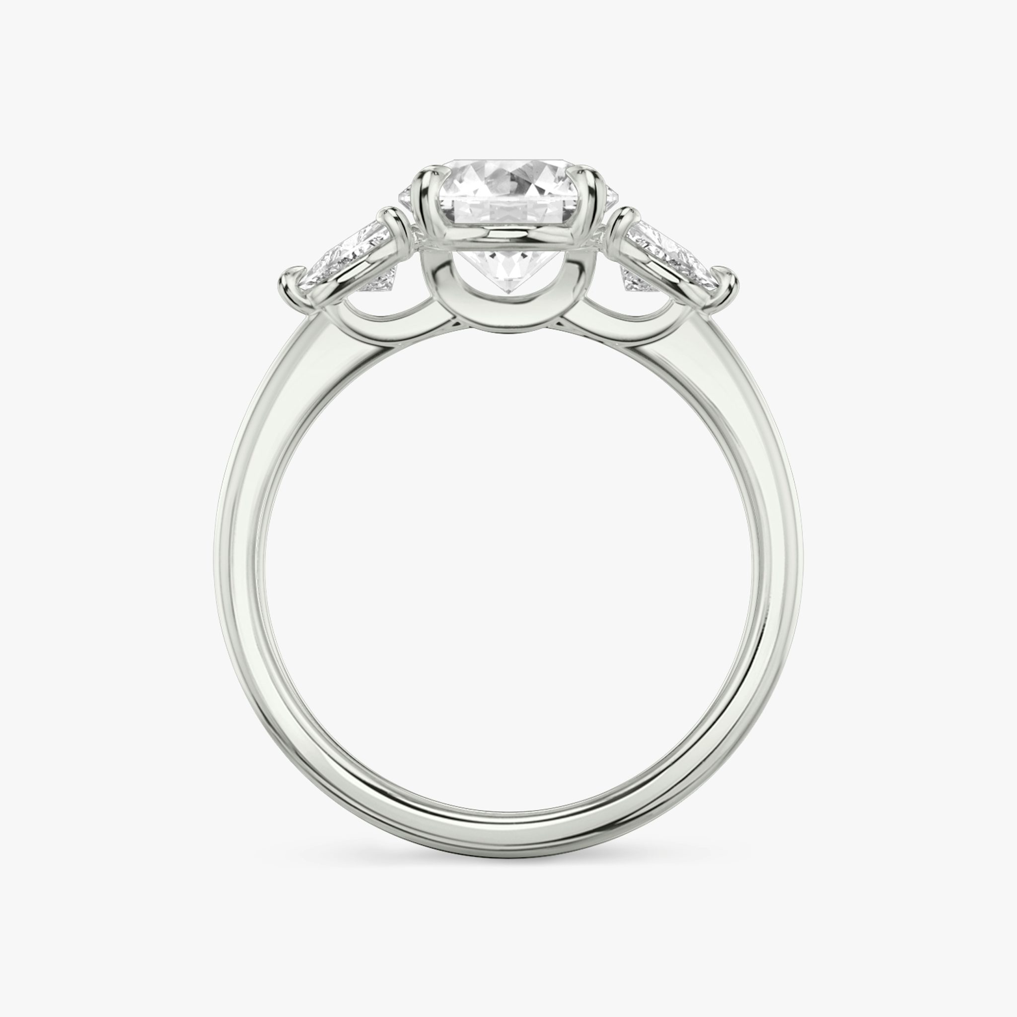 The Three Stone | Round Brilliant | 18k | White Gold | bandAccent: Plain | caratWeight: other | sideStoneCarat: 0.25ct | sideStoneShape: Trillion | diamondOrientation: vertical