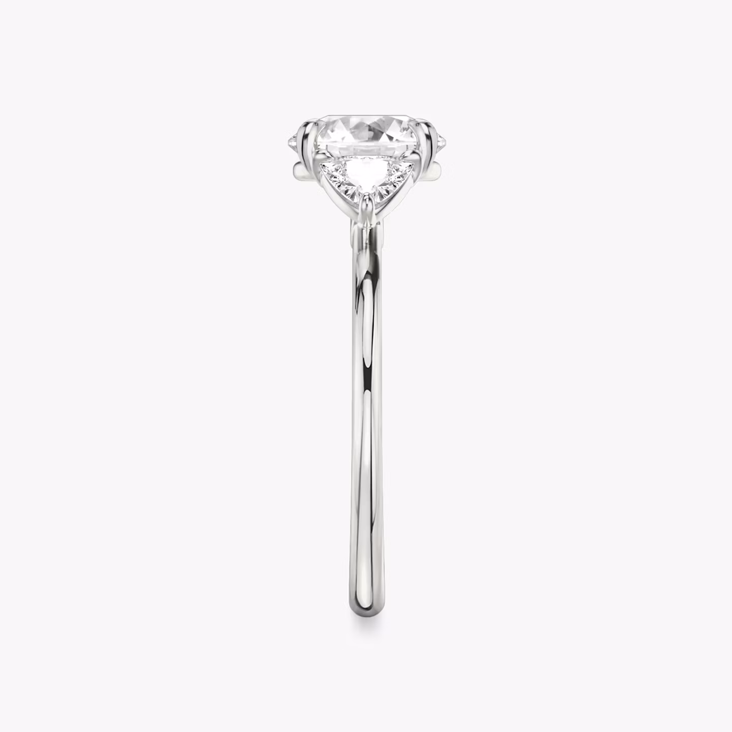 The Three Stone | Round Brilliant | 18k | White Gold | bandAccent: Plain | caratWeight: other | sideStoneCarat: 0.25ct | sideStoneShape: Trillion | diamondOrientation: vertical
