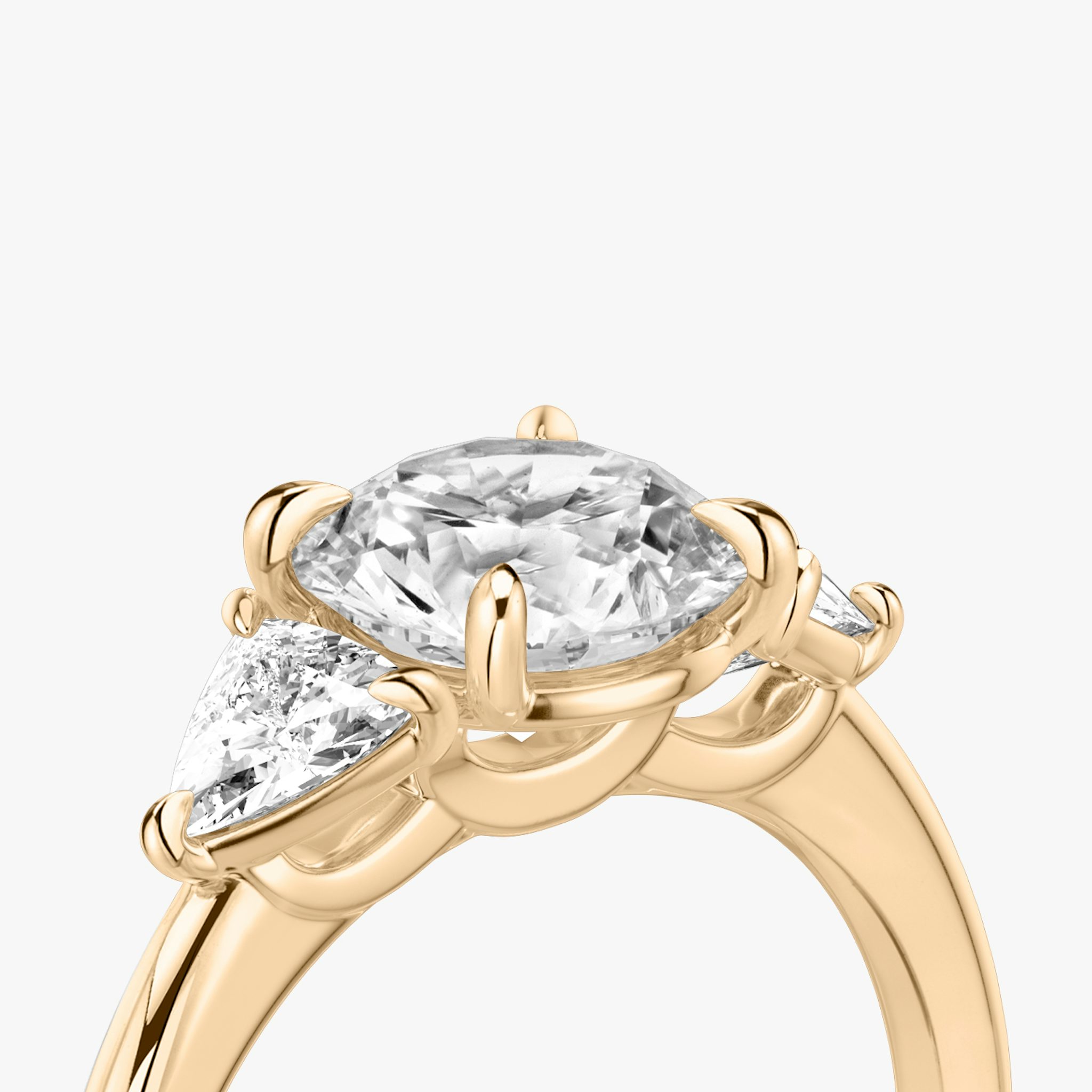 The Three Stone | Round Brilliant | 14k | Rose Gold | bandAccent: Plain | caratWeight: other | sideStoneCarat: 0.25ct | sideStoneShape: Trillion | diamondOrientation: vertical