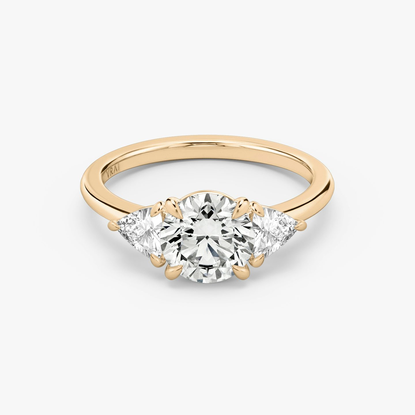 The Three Stone | Round Brilliant | 14k | Rose Gold | bandAccent: Plain | caratWeight: other | sideStoneCarat: 0.25ct | sideStoneShape: Trillion | diamondOrientation: vertical