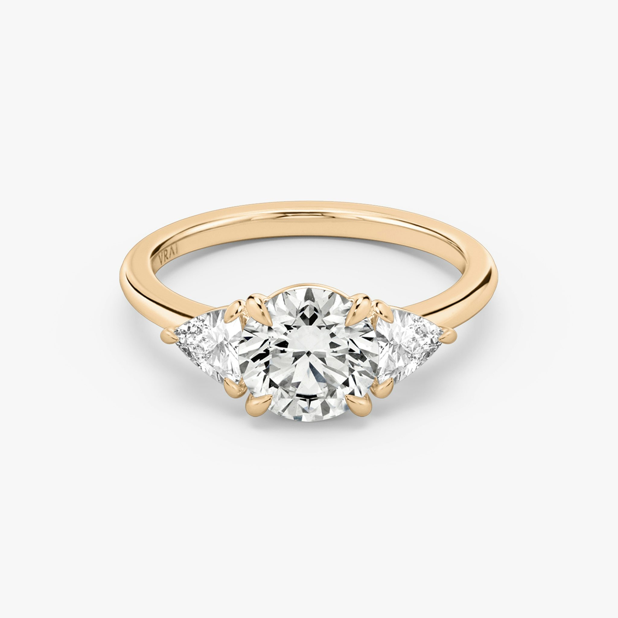 The Three Stone | Round Brilliant | 14k | Rose Gold | bandAccent: Plain | caratWeight: other | sideStoneCarat: 0.25ct | sideStoneShape: Trillion | diamondOrientation: vertical