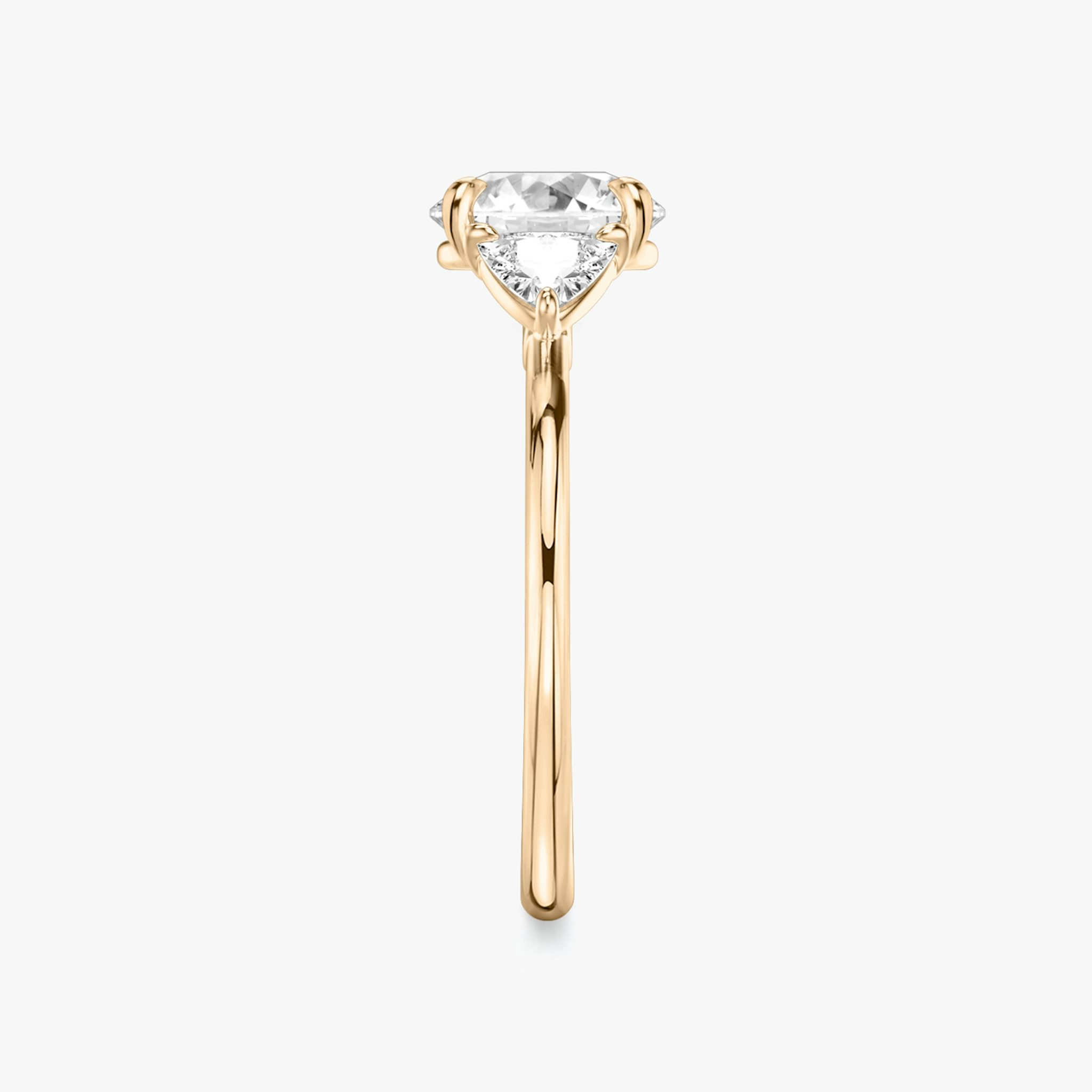 The Three Stone | Round Brilliant | 14k | Rose Gold | bandAccent: Plain | caratWeight: other | sideStoneCarat: 0.25ct | sideStoneShape: Trillion | diamondOrientation: vertical