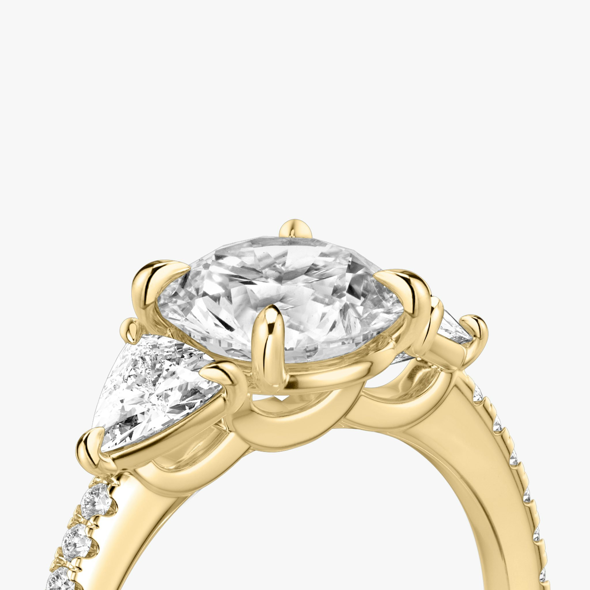 The Three Stone | Round Brilliant | 18k | Yellow Gold | bandAccent: Pavé | caratWeight: other | sideStoneCarat: 0.25ct | sideStoneShape: Trillion | diamondOrientation: vertical