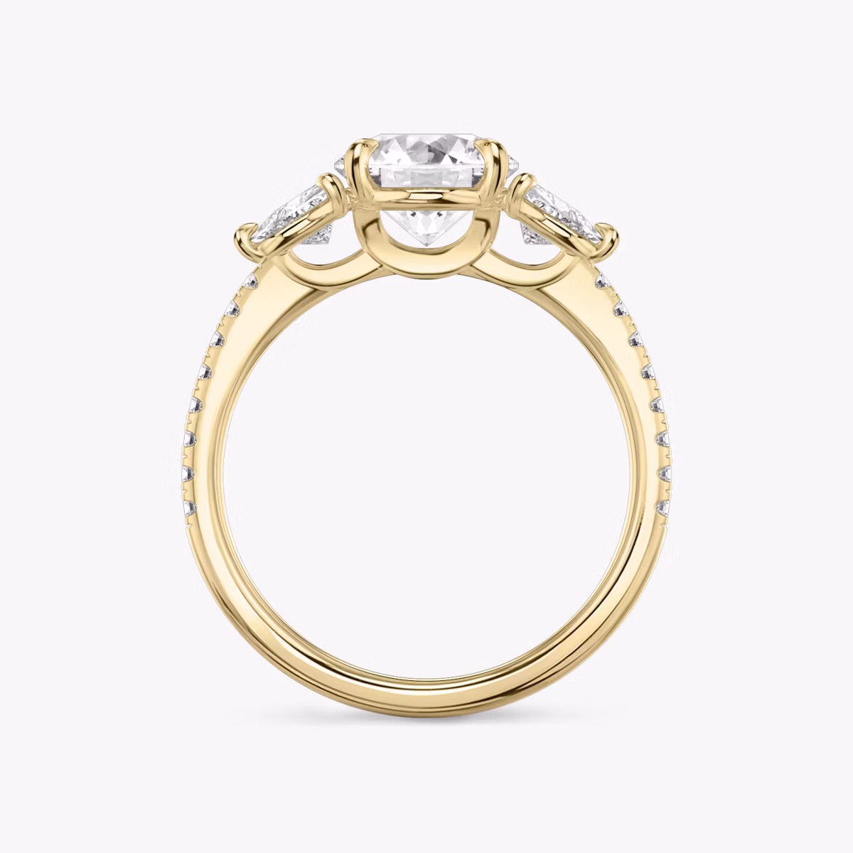 The Three Stone | Round Brilliant | 18k | Yellow Gold | bandAccent: Pavé | caratWeight: other | sideStoneCarat: 0.25ct | sideStoneShape: Trillion | diamondOrientation: vertical