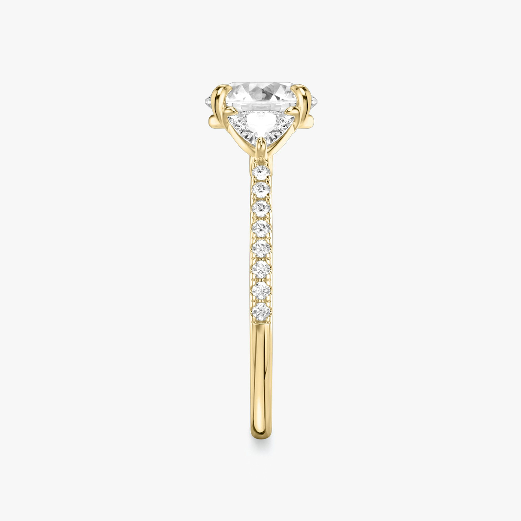 The Three Stone | Round Brilliant | 18k | Yellow Gold | bandAccent: Pavé | caratWeight: other | sideStoneCarat: 0.25ct | sideStoneShape: Trillion | diamondOrientation: vertical