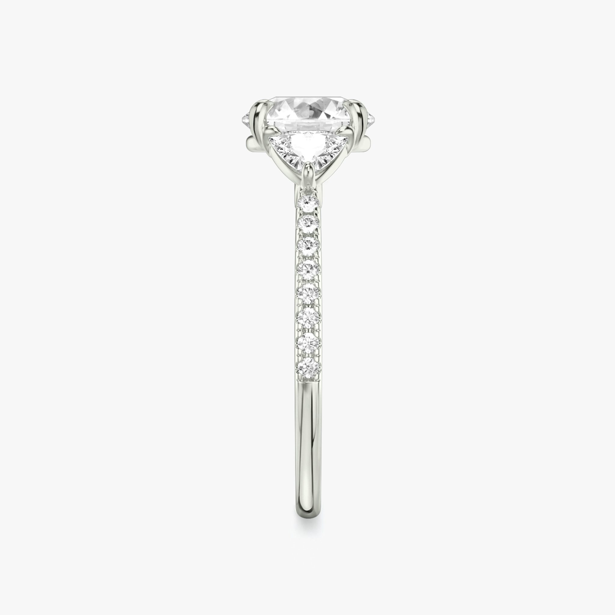 The Three Stone | Round Brilliant | 18k | White Gold | bandAccent: Pavé | caratWeight: other | sideStoneCarat: 0.25ct | sideStoneShape: Trillion | diamondOrientation: vertical