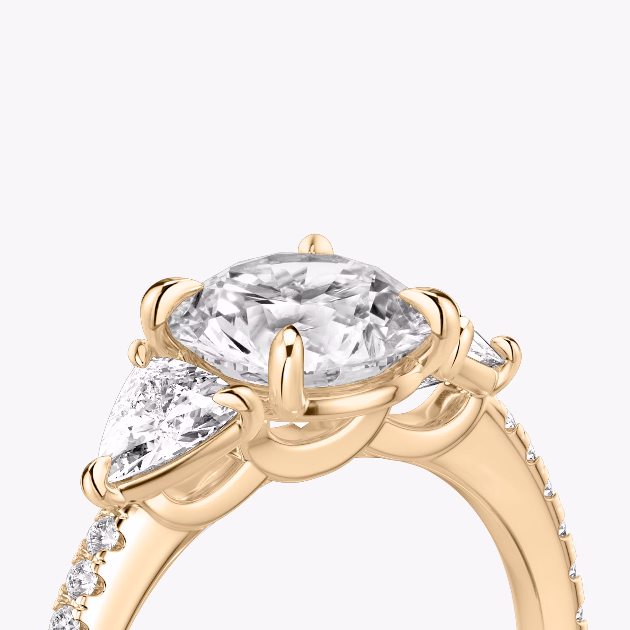 The Three Stone | Round Brilliant | 14k | Rose Gold | bandAccent: Pavé | caratWeight: other | sideStoneCarat: 0.25ct | sideStoneShape: Trillion | diamondOrientation: vertical