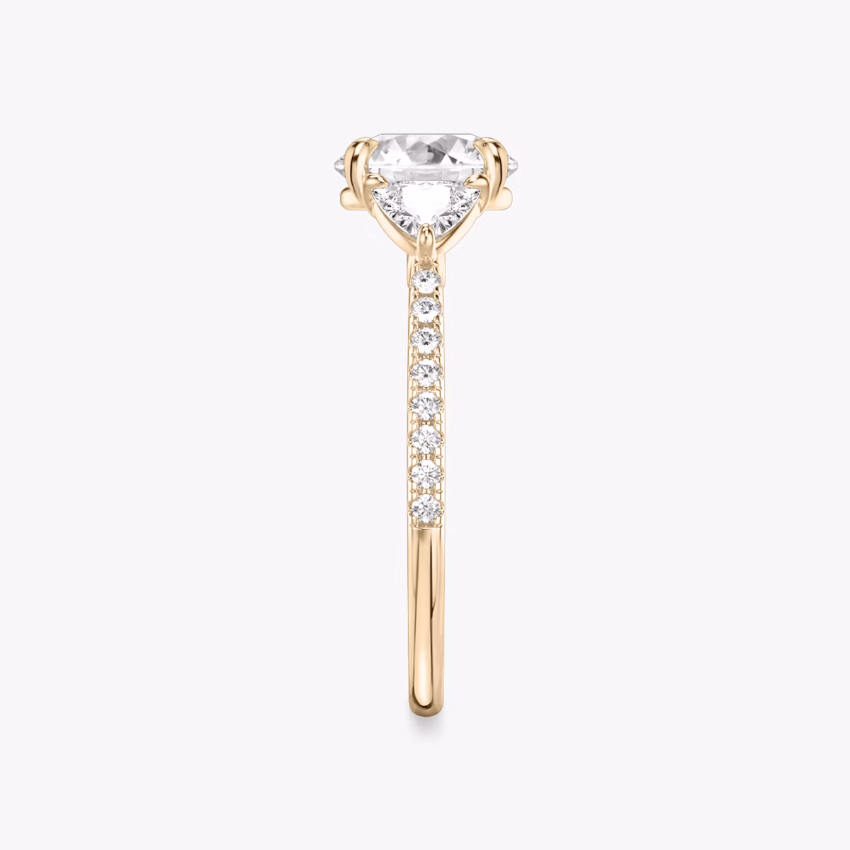 The Three Stone | Round Brilliant | 14k | Rose Gold | bandAccent: Pavé | caratWeight: other | sideStoneCarat: 0.25ct | sideStoneShape: Trillion | diamondOrientation: vertical