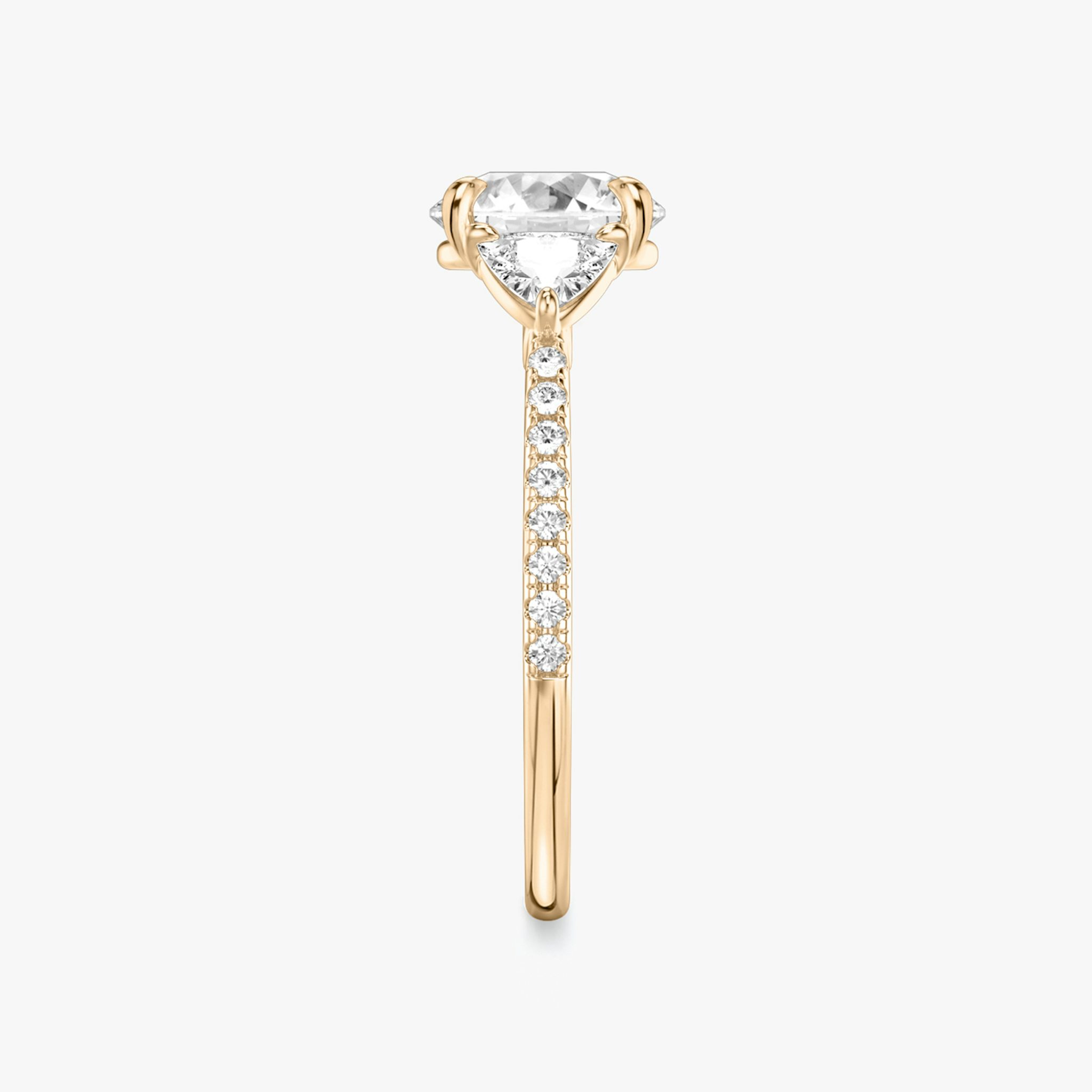 The Three Stone | Round Brilliant | 14k | Rose Gold | bandAccent: Pavé | caratWeight: other | sideStoneCarat: 0.25ct | sideStoneShape: Trillion | diamondOrientation: vertical