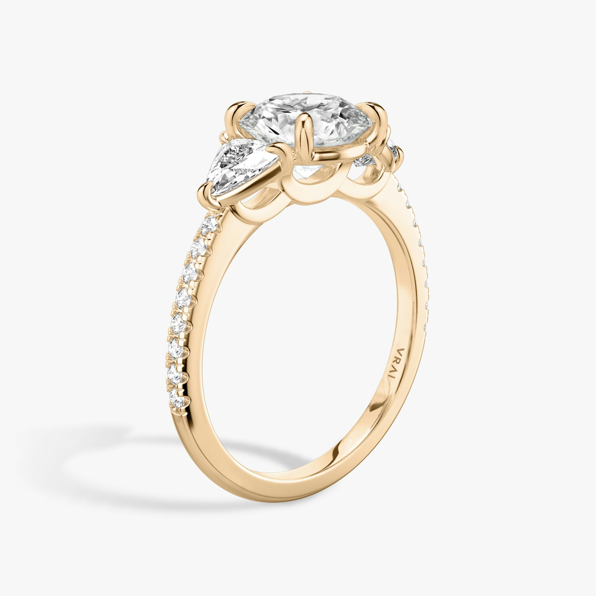 The Three Stone | Round Brilliant | 14k | Rose Gold | bandAccent: Pavé | caratWeight: other | sideStoneCarat: 0.25ct | sideStoneShape: Trillion | diamondOrientation: vertical