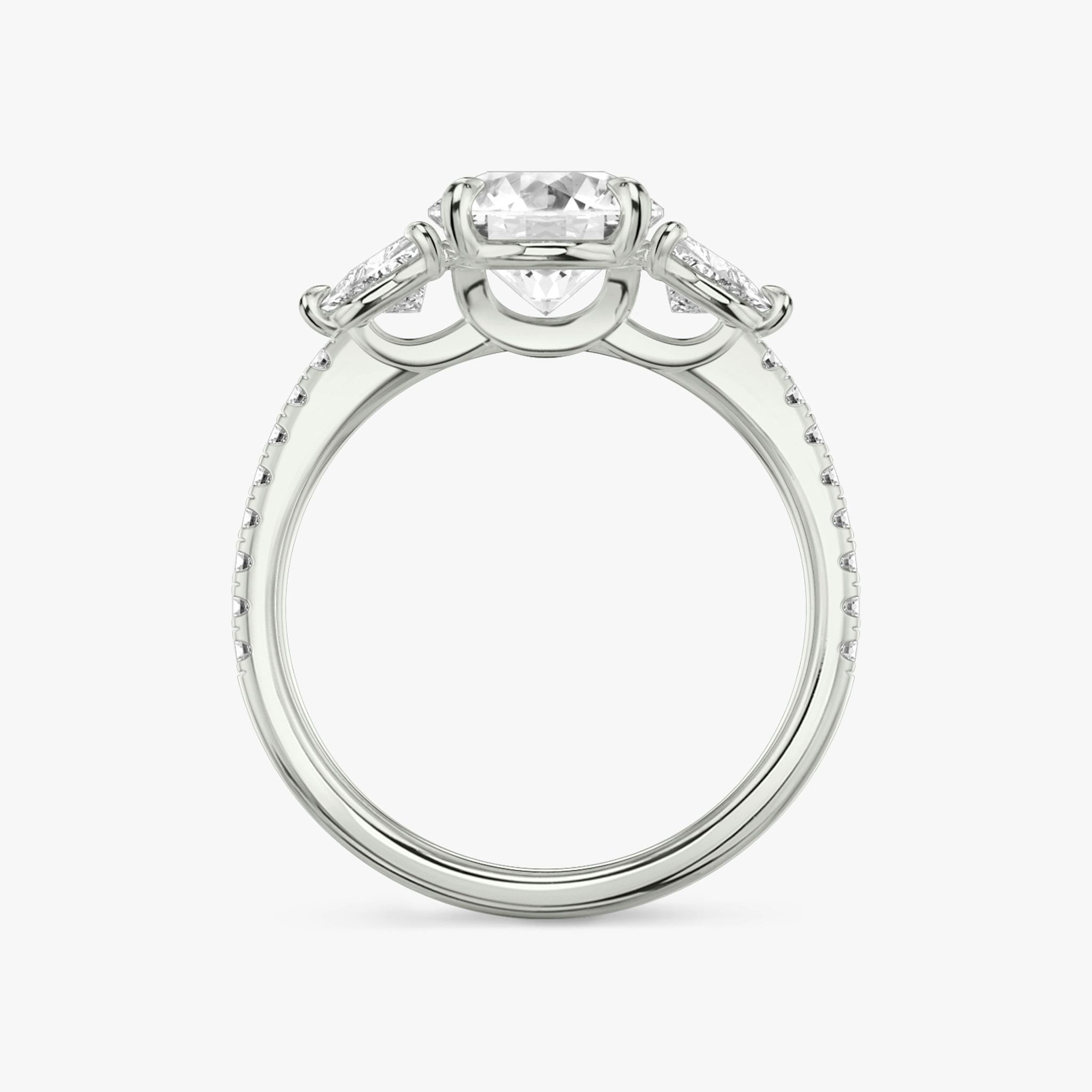 The Three Stone | Round Brilliant | Platinum | bandAccent: Pavé | caratWeight: other | sideStoneCarat: 0.25ct | sideStoneShape: Trillion | diamondOrientation: vertical
